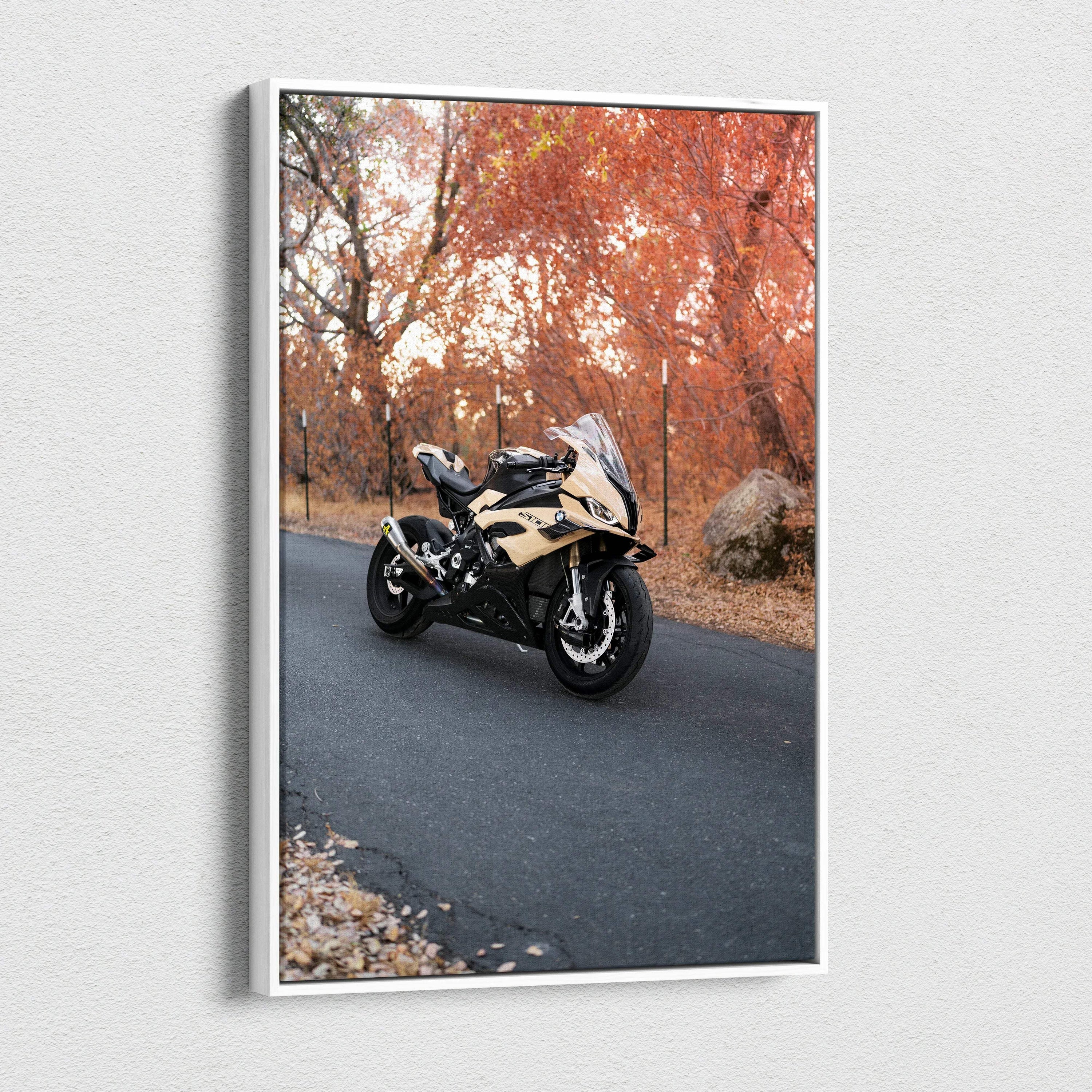 Vertical canvas wall art of a BMW S1000RR motorcycle on a road with autumn trees.