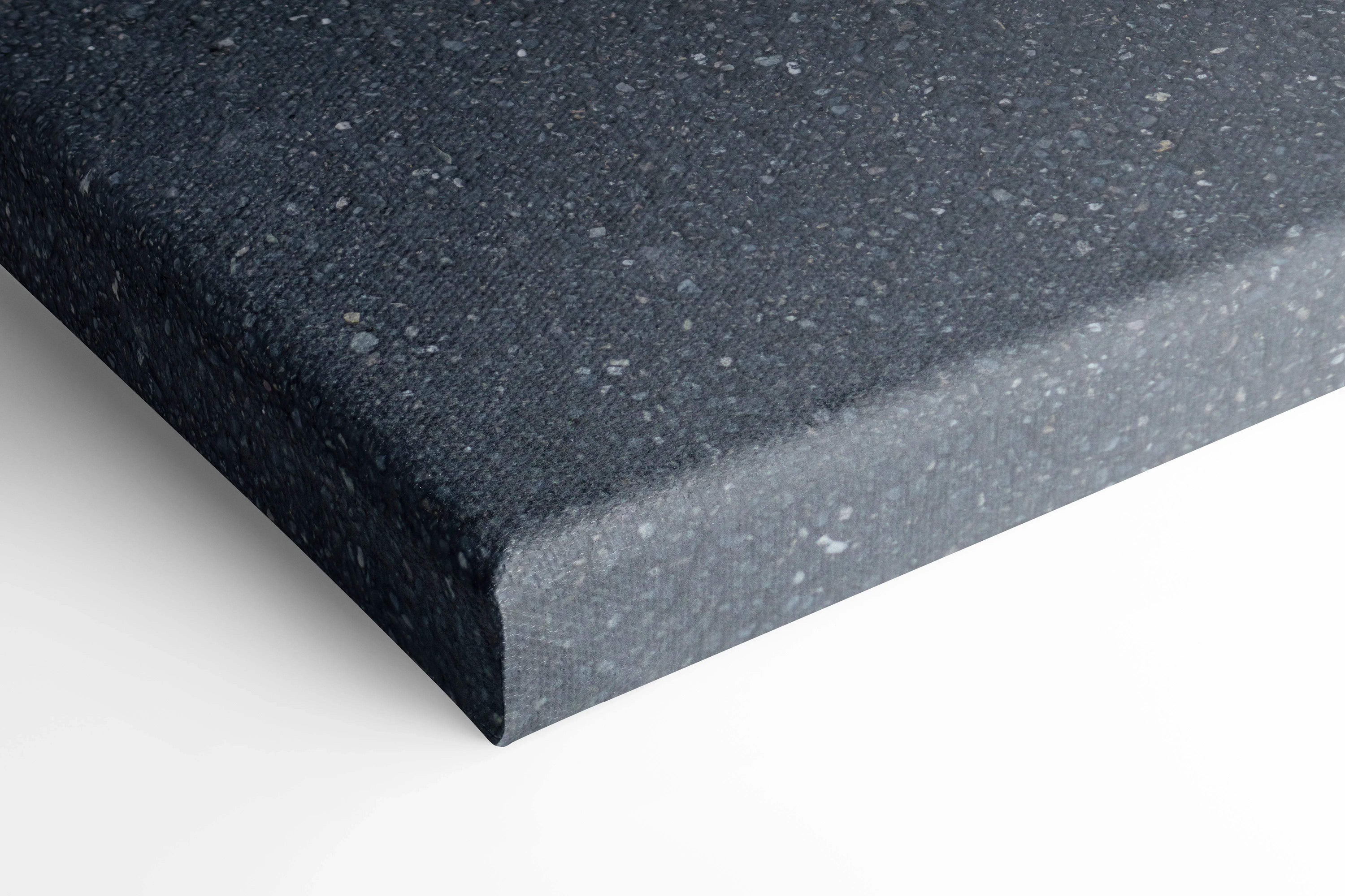 Close-up of black textured canvas corner, museum-quality wall art with sharp edges.