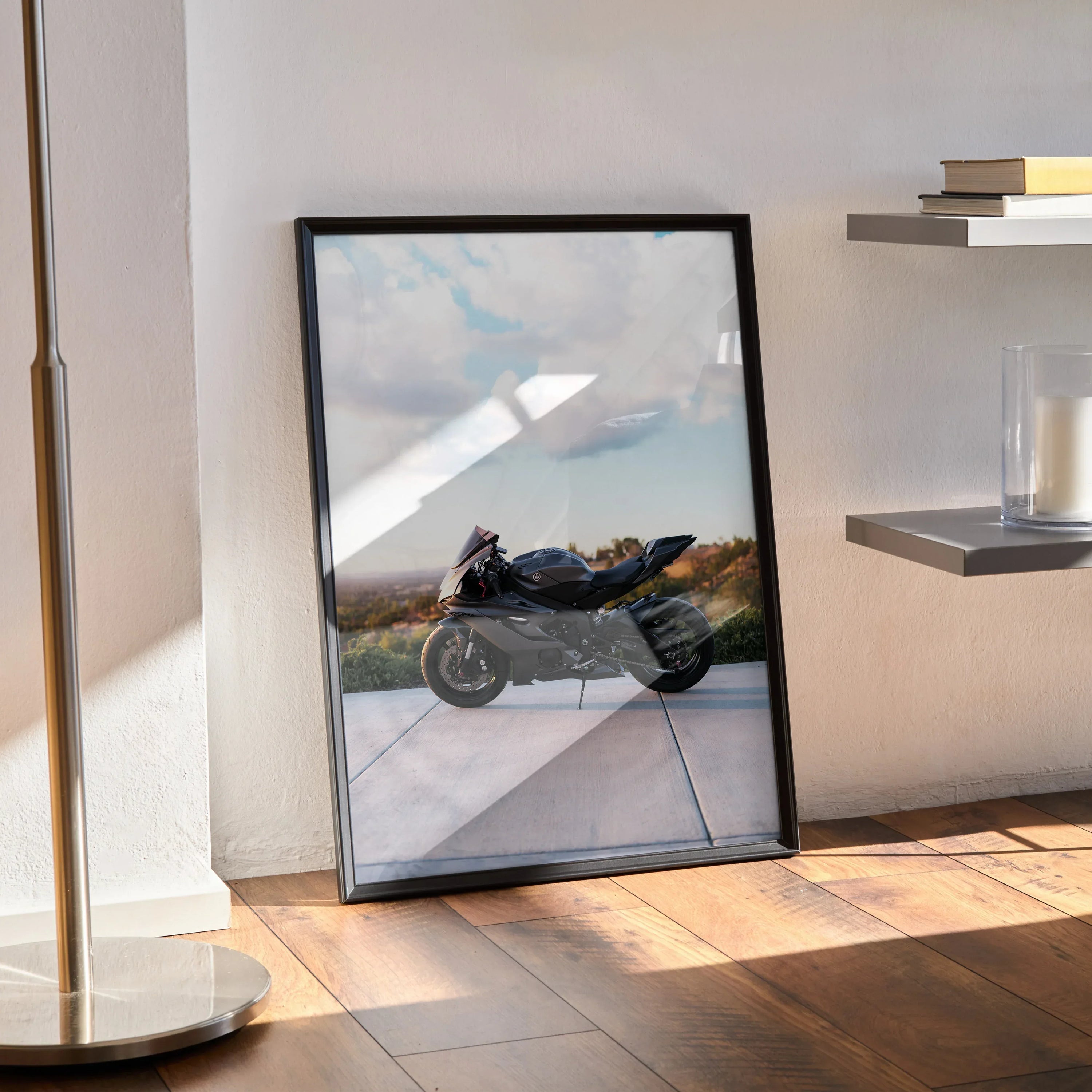 Yamaha R6 motorcycle poster with sleek black frame, leaning against wall in sunlit room, modern wall art.