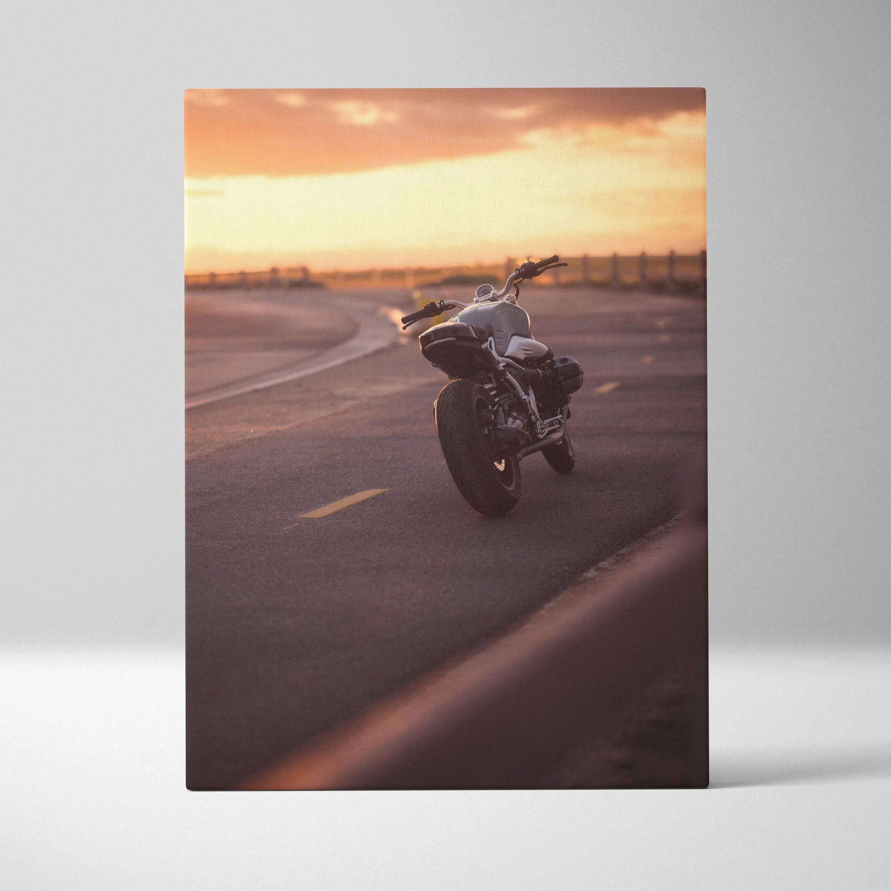 Vertical canvas wall art featuring BMW R Nine T motorcycle at sunset with warm tones and smooth asphalt road.