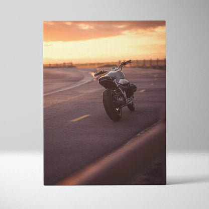 Vertical canvas wall art featuring BMW R Nine T motorcycle at sunset with warm tones and smooth asphalt road.
