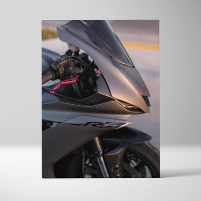 Yamaha R6 motorcycle close-up canvas art with sleek metallic silver front fairing and pink brake lever wall art.