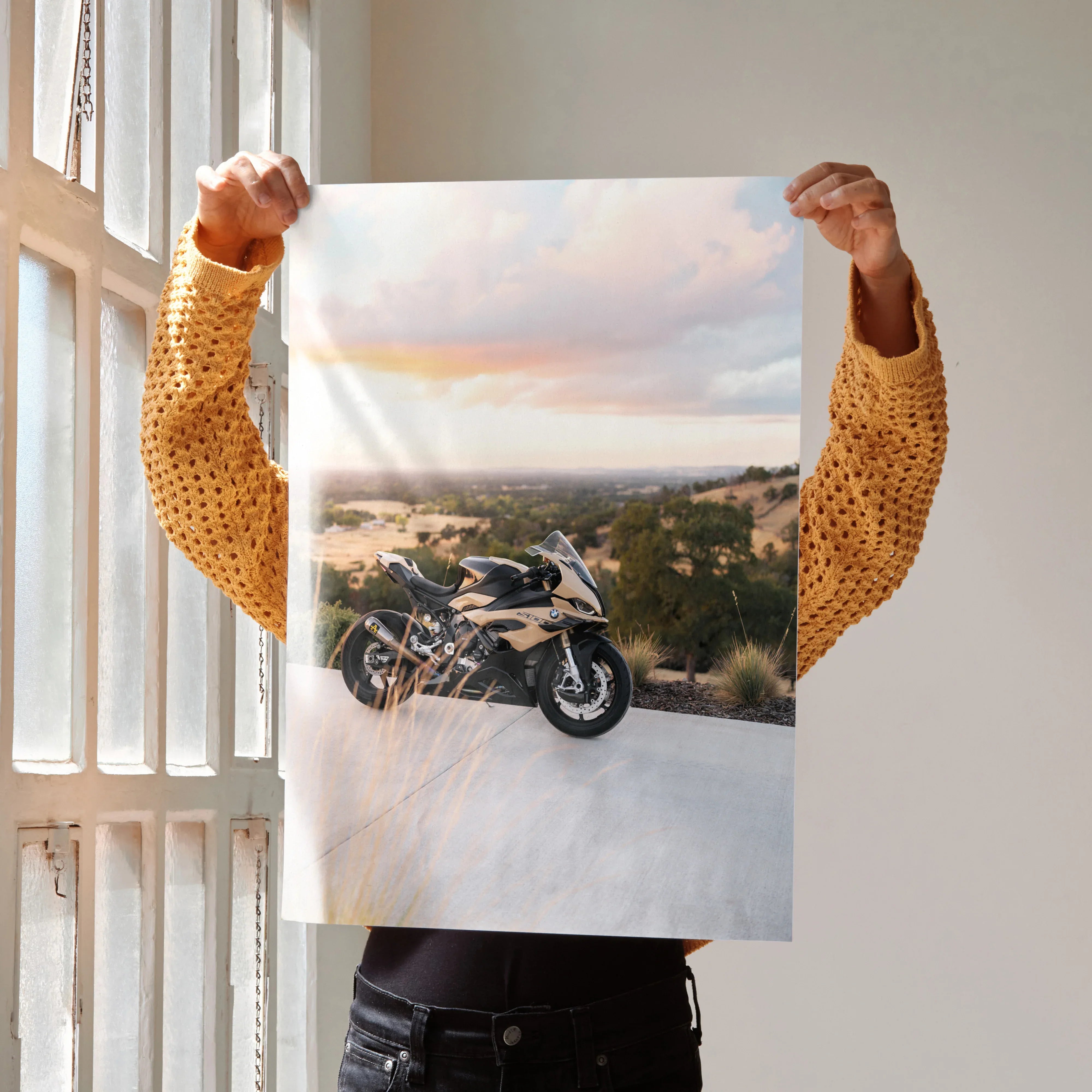 BMW S1000RR motorcycle poster showing the bike on a road with scenic sunset background wall art.