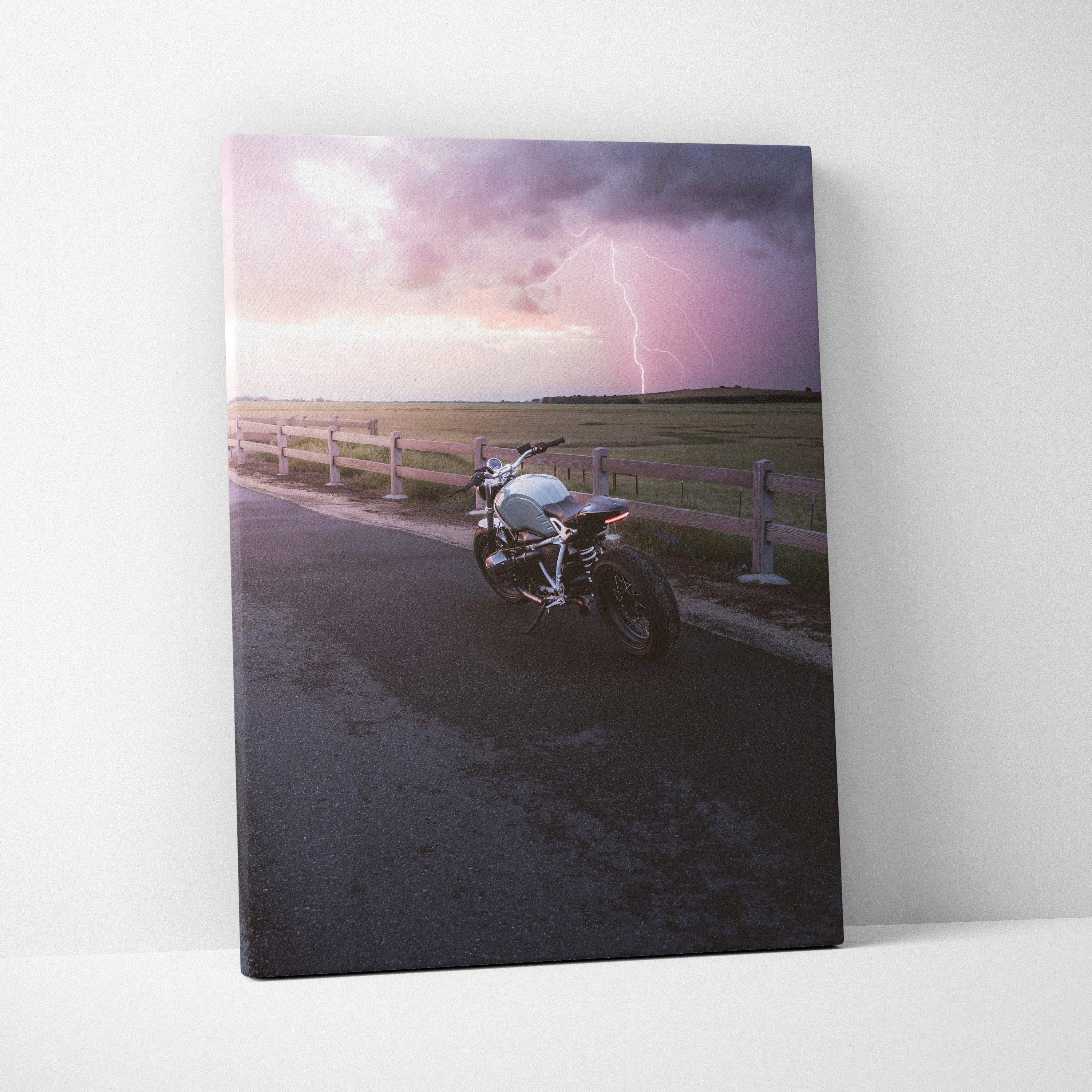 BMW R Nine T motorcycle on road with lightning sky, vertical canvas wall art print.
