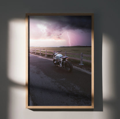 BMW R Nine T motorcycle parked on road with stormy sky and lightning, poster wall art.