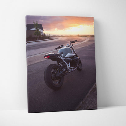 BMW R Nine T motorcycle at sunset on canvas wall art with vibrant orange sky background.