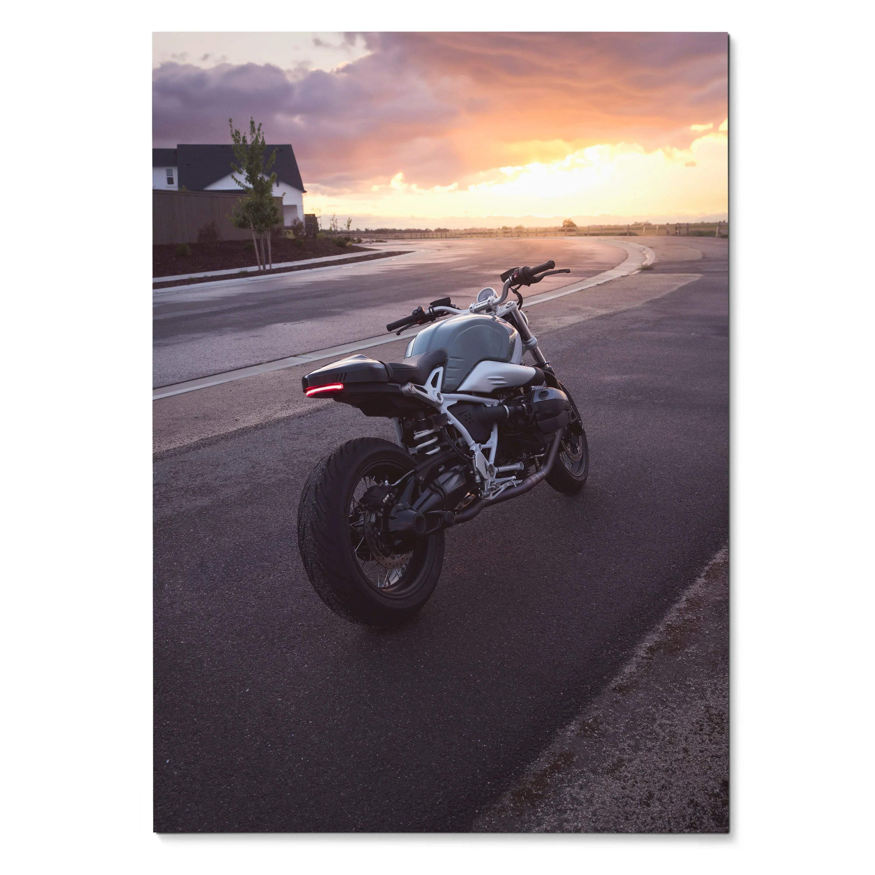 BMW R Nine T motorcycle parked on road at sunset poster wall art with warm sky colors.