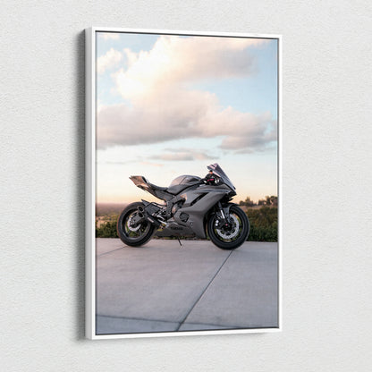 Vertical canvas art of a black Yamaha R6 motorcycle against a cloudy sky background.