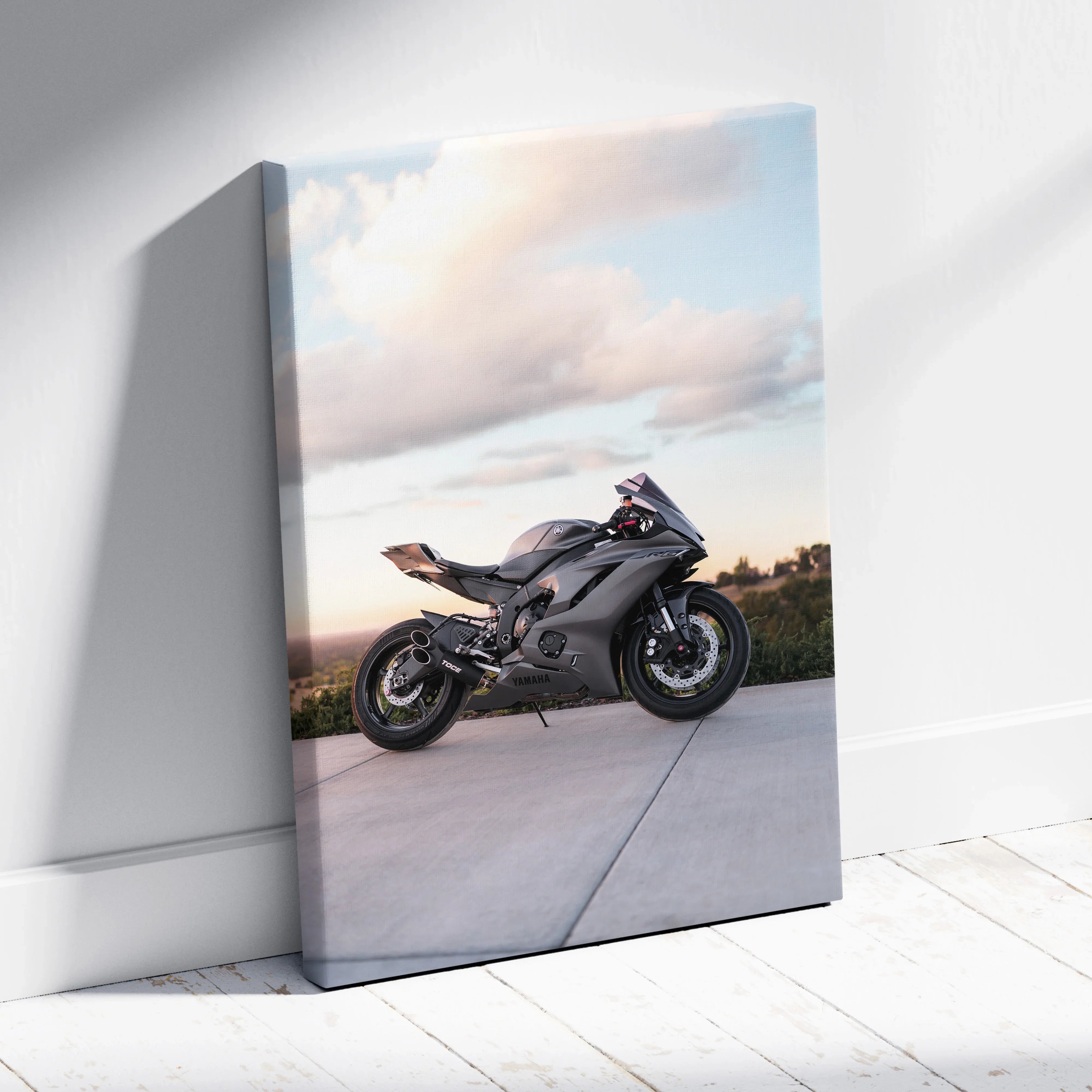Yamaha R6 motorcycle on canvas art wall print with blue sky background and concrete foreground.