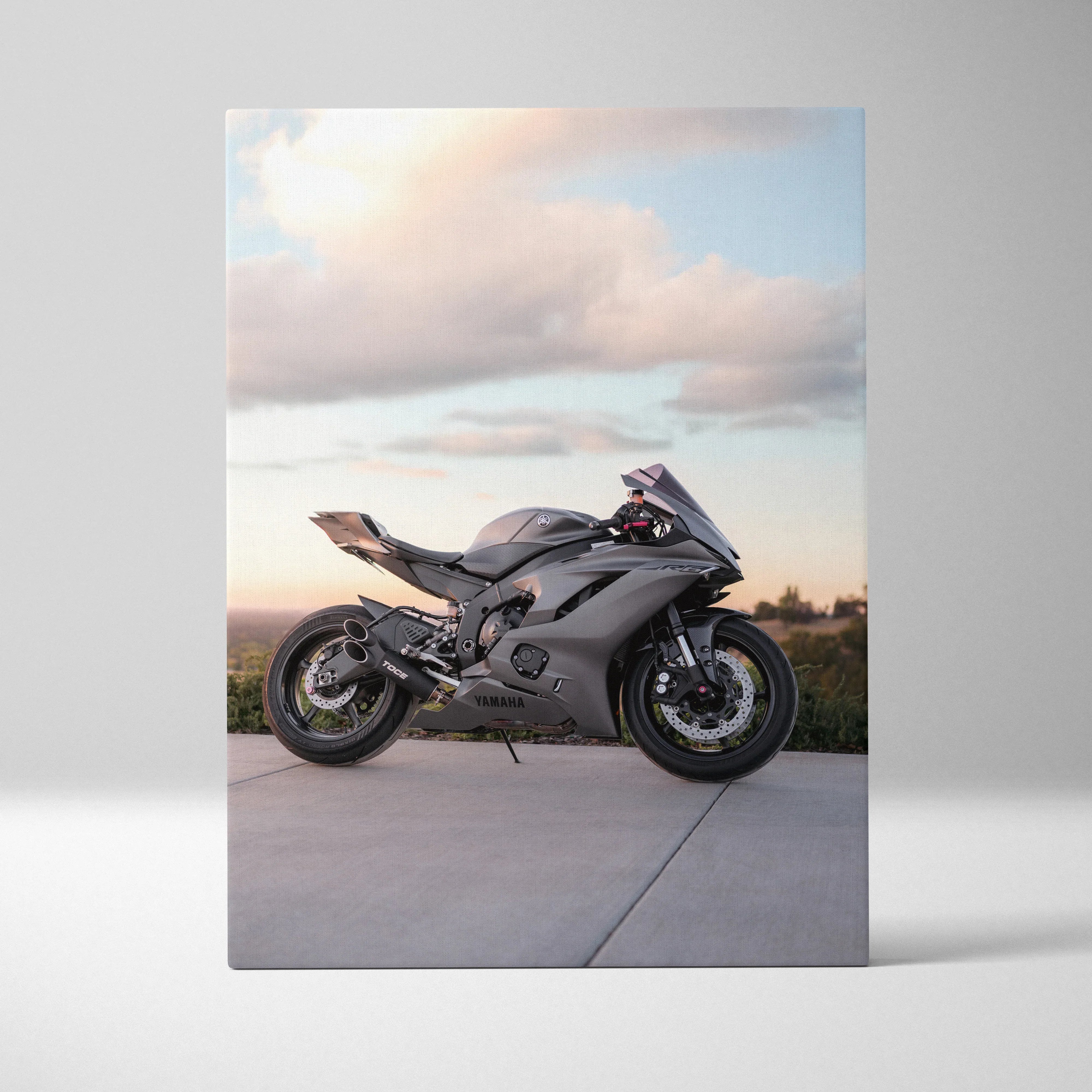 Yamaha R6 motorcycle canvas art with sleek gray bike against soft sky background wall art poster.
