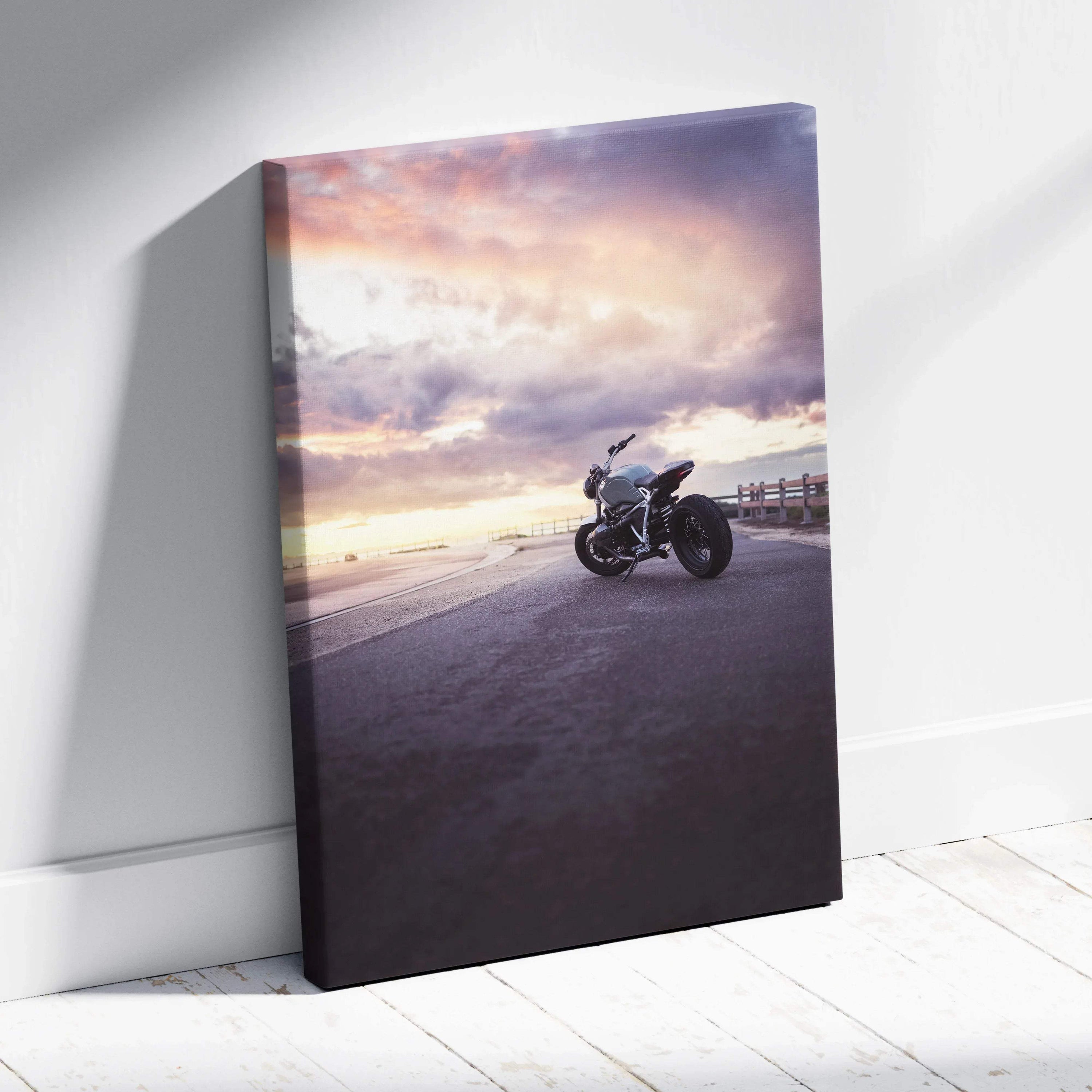 BMW R Nine T motorcycle at sunset on canvas wall art with dramatic sky background.