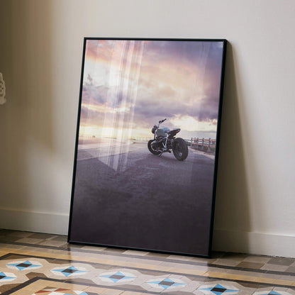 BMW R Nine T motorcycle poster leaning against wall with dramatic sunset sky wall art.