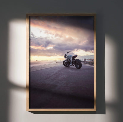 BMW R Nine T motorcycle parked at sunset with dramatic sky, framed poster wall art.