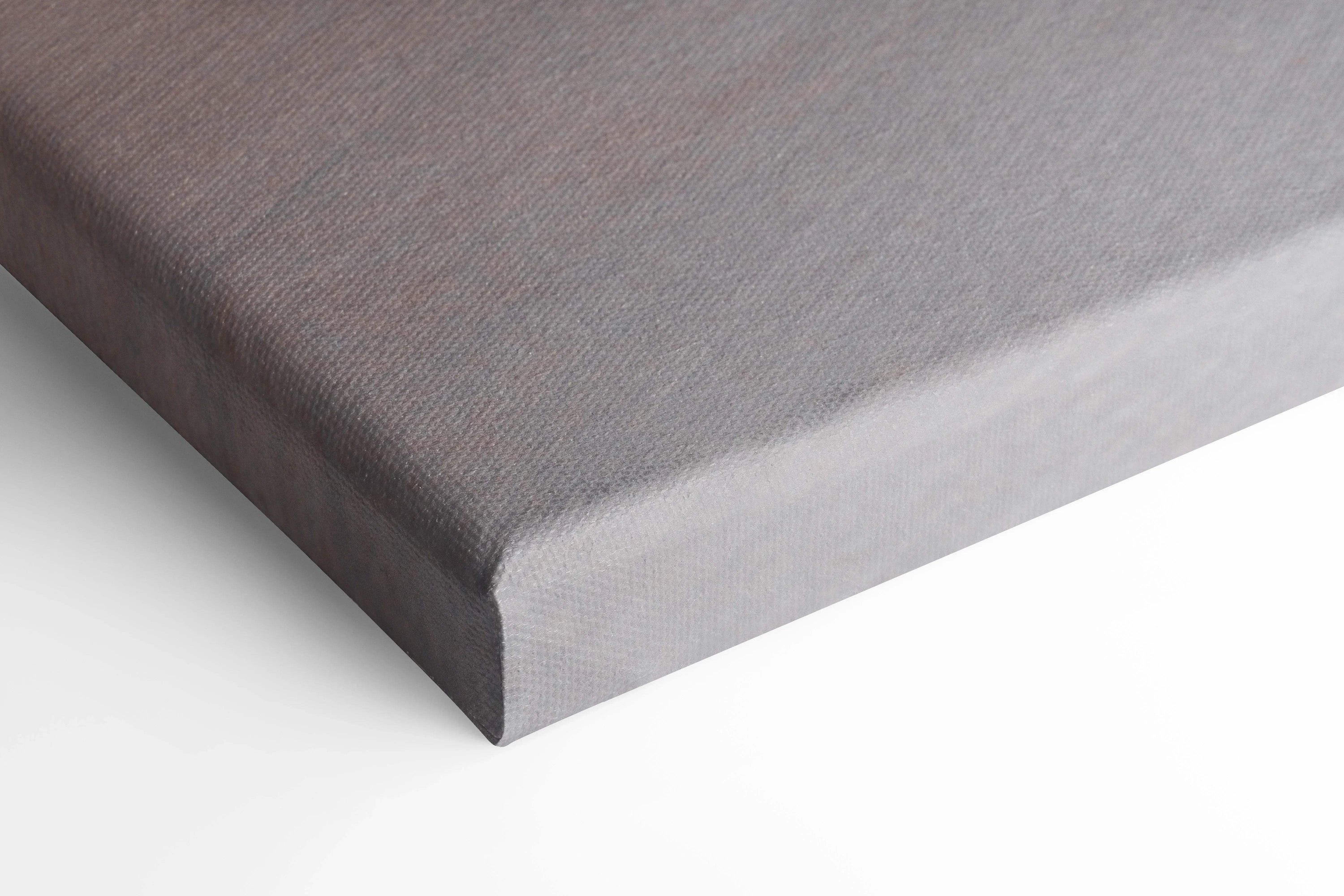 Close-up of gray fabric texture on corner of stretched canvas wall art with clean edges.