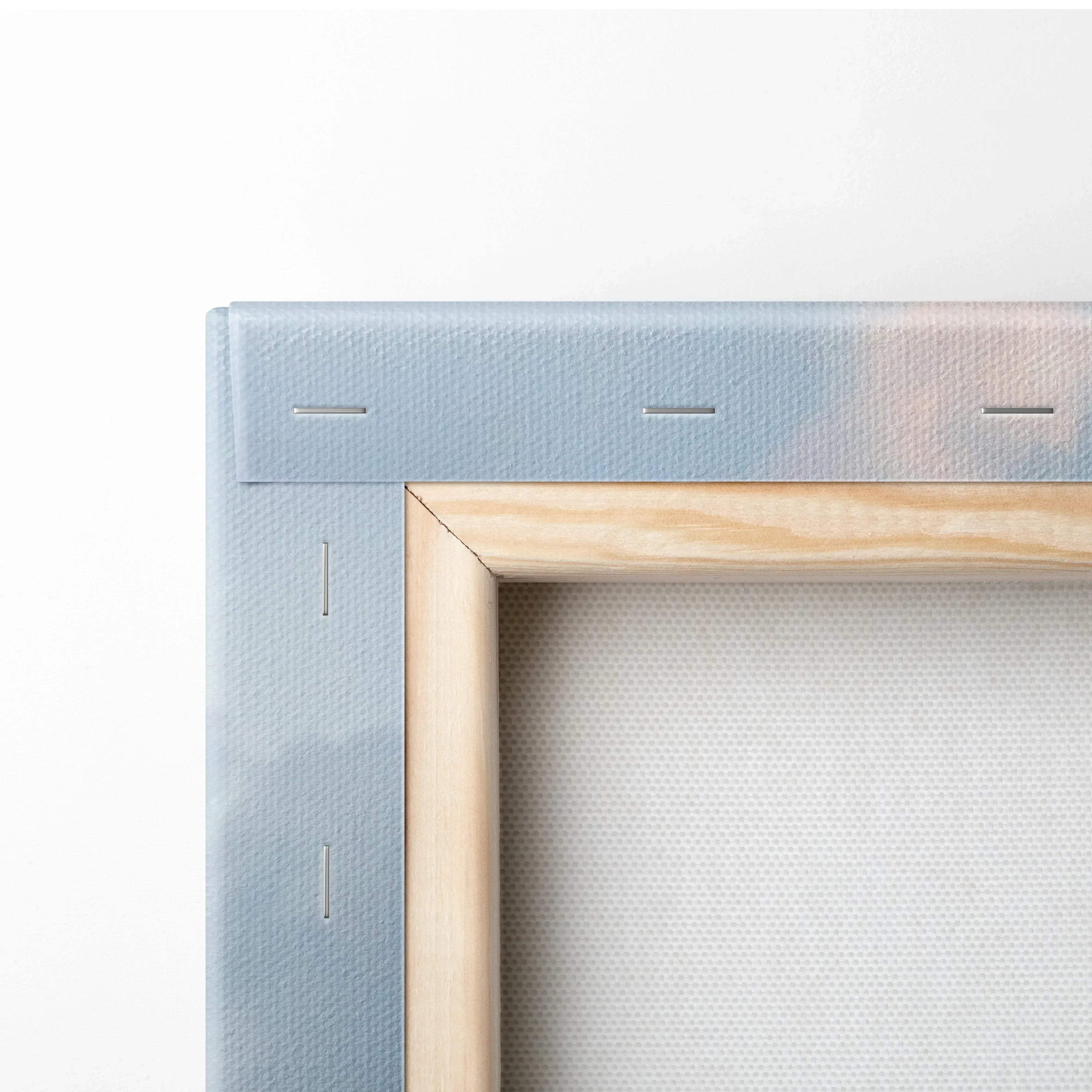Close-up of stretched canvas wall art corner with wooden frame and neat staples on museum-quality canvas.