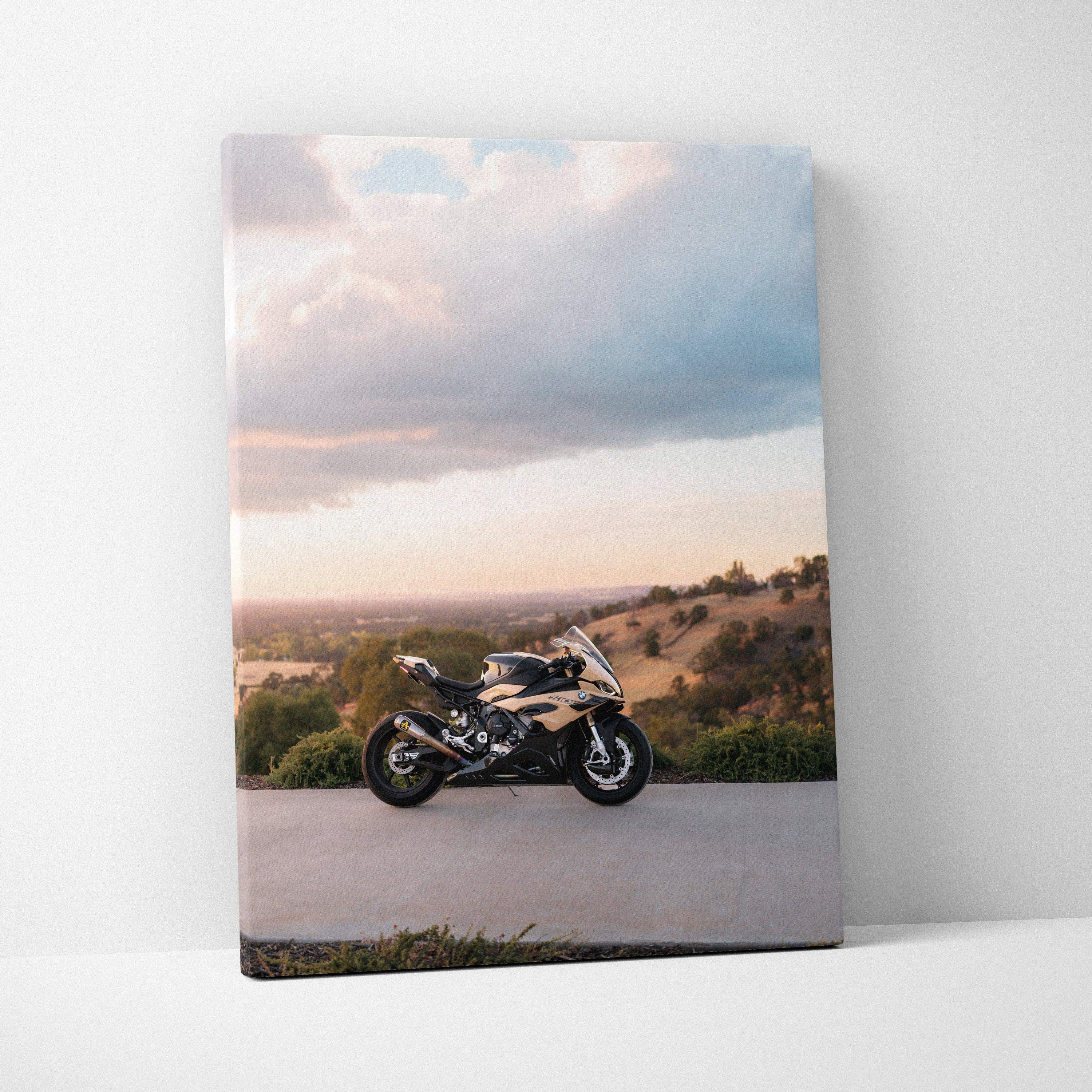 Vertical canvas wall art featuring a BMW S1000RR motorcycle against a scenic sunset background.