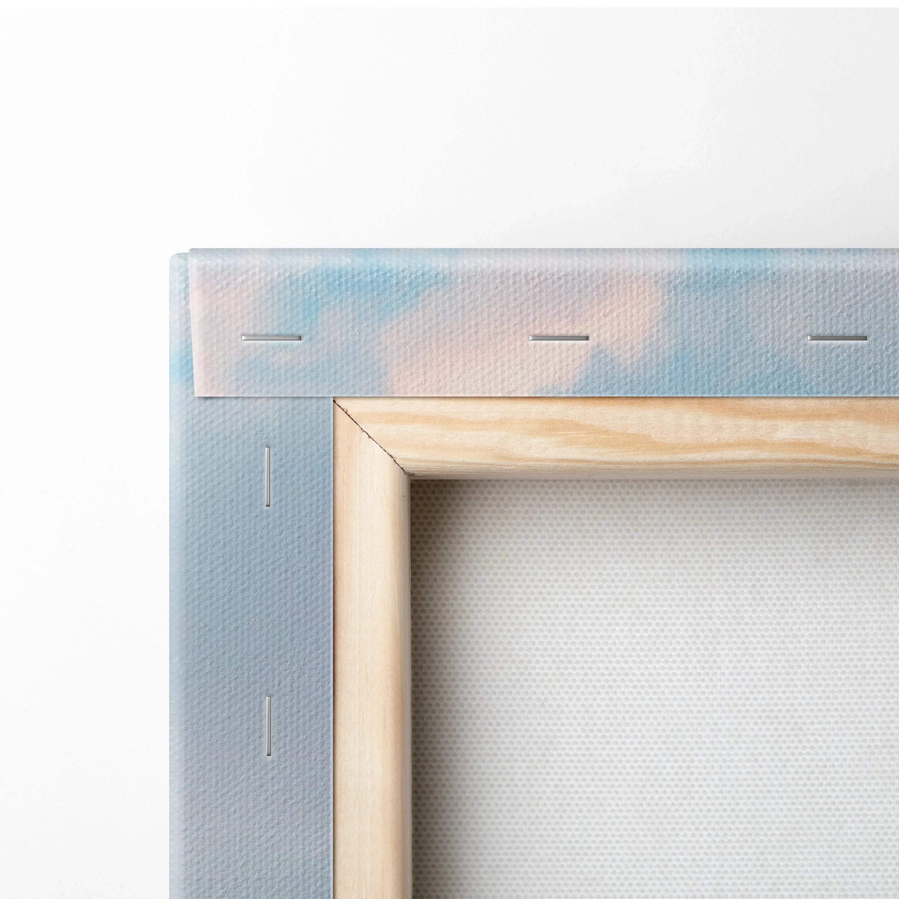 Close-up of stretched white canvas on wooden frame with staples, wall art canvas detail.