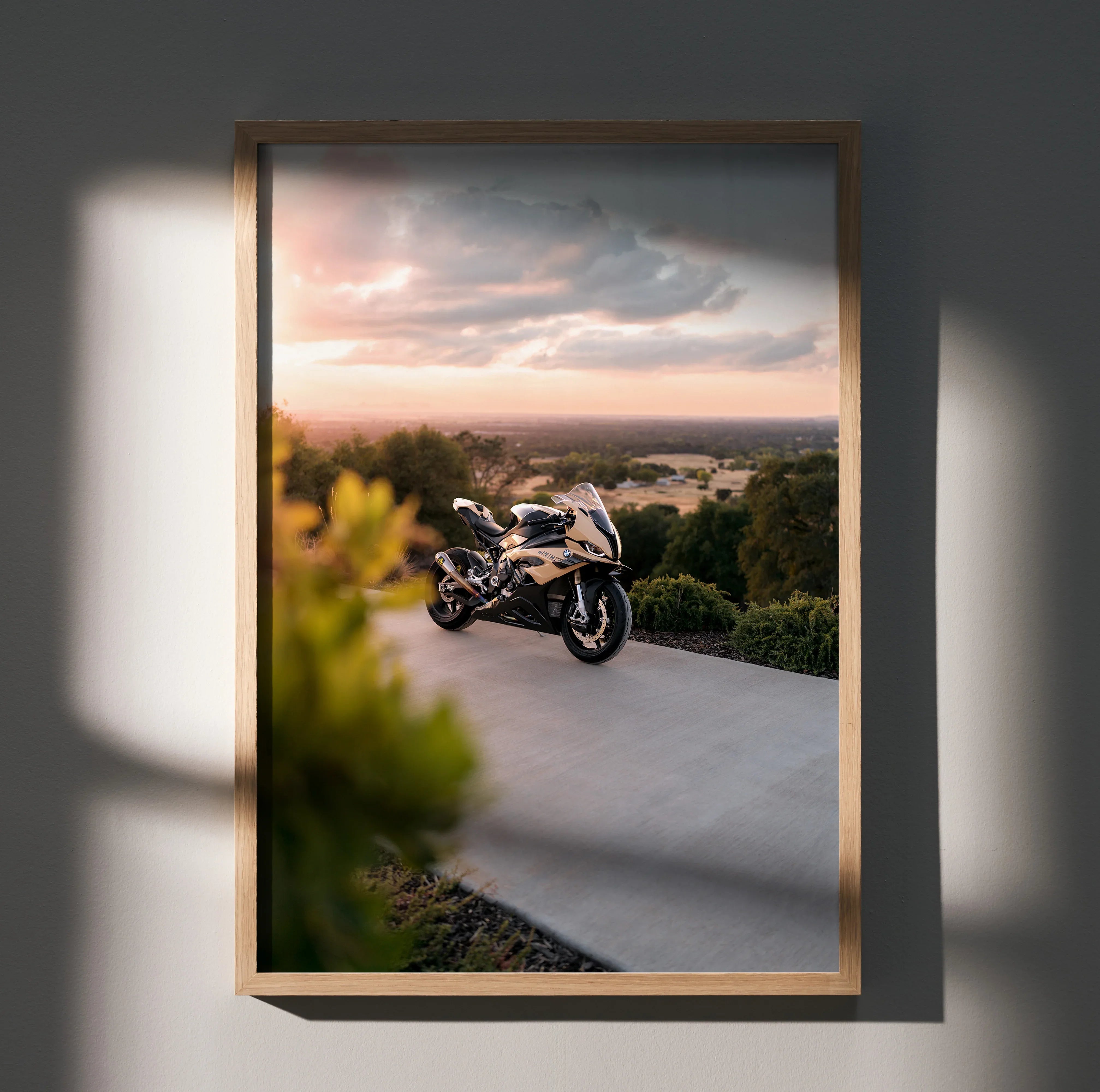BMW S1000RR motorcycle poster with sunset backdrop, framed wall art in natural wood.