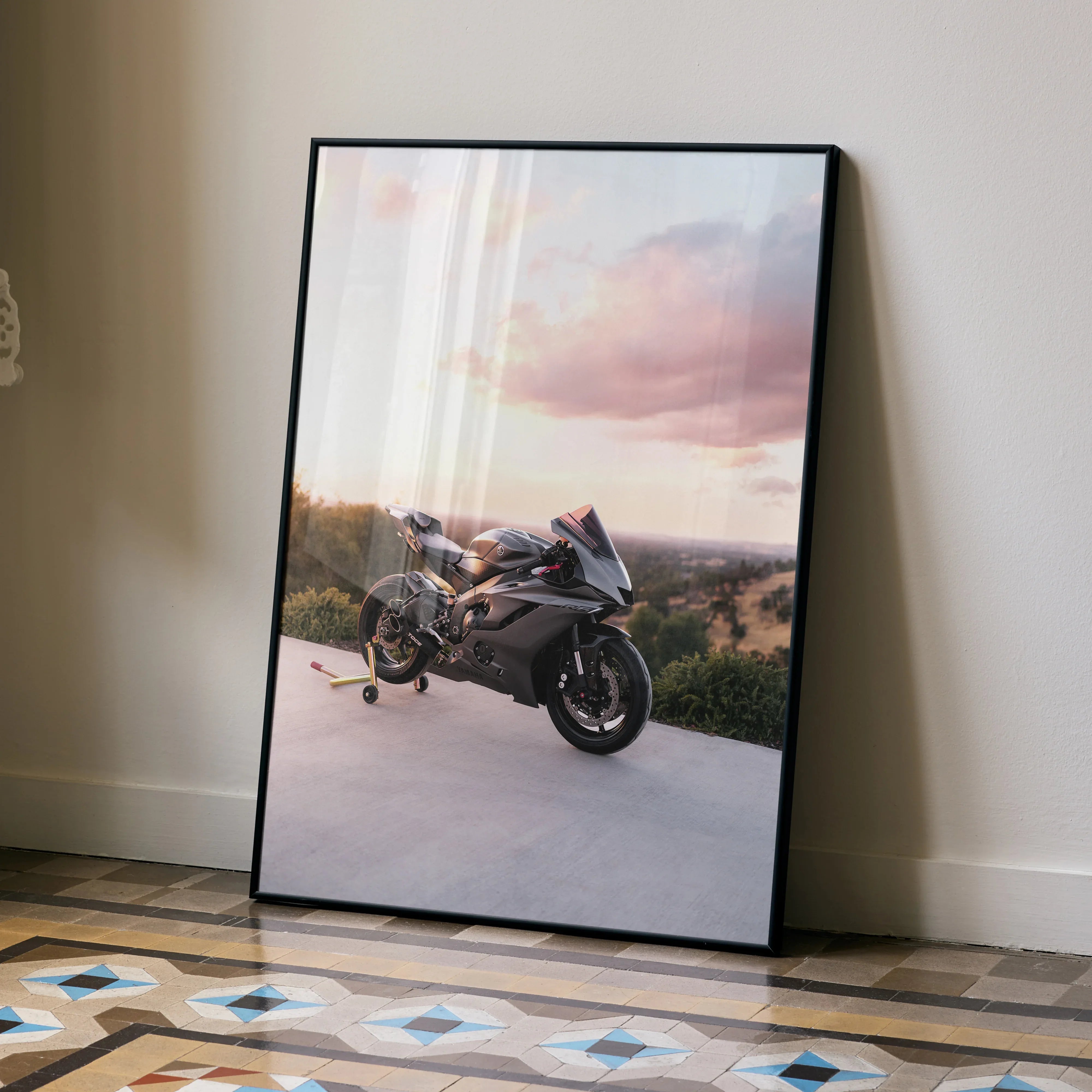 Yamaha R6 motorcycle poster leaning against wall with sunset sky, modern wall art.