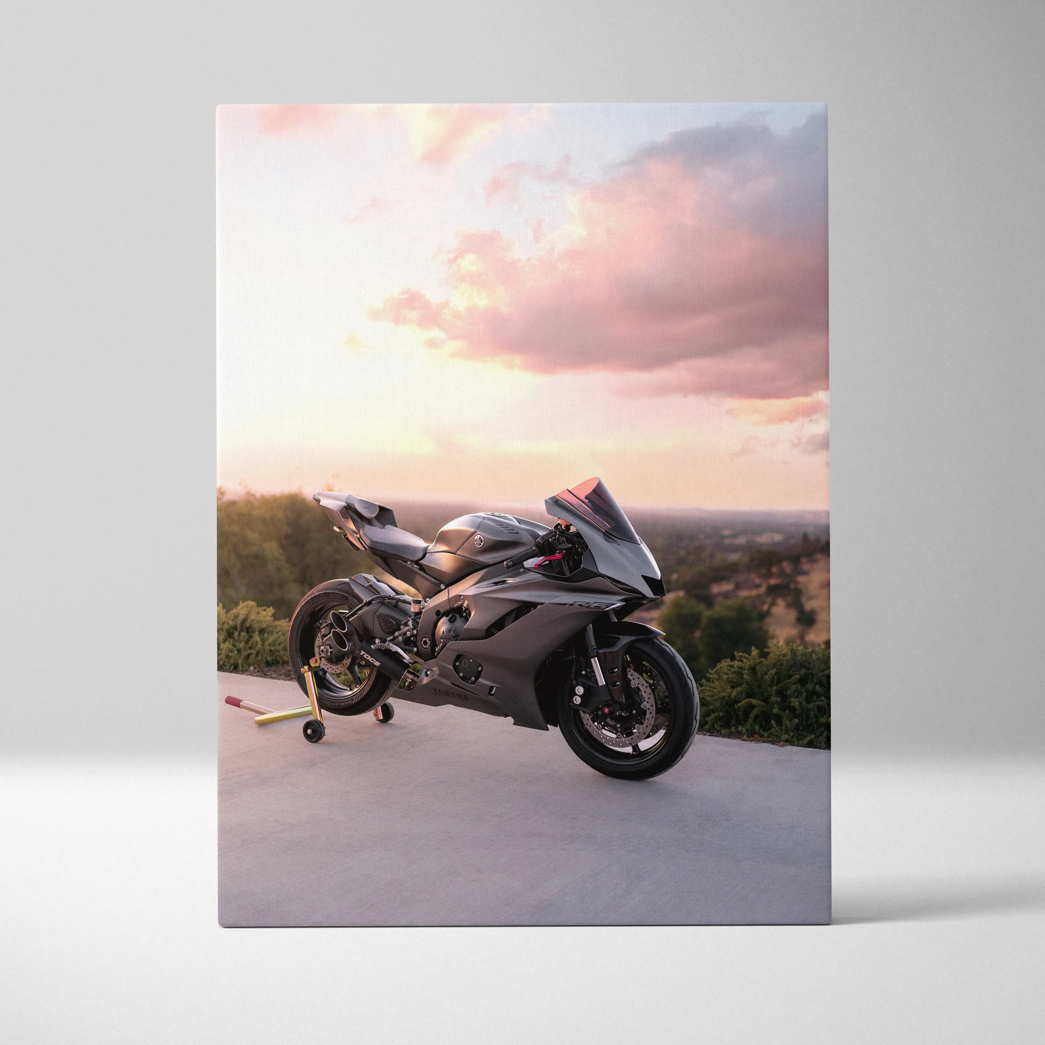 Yamaha R6 sport motorcycle at sunset on canvas wall art with soft sky background.