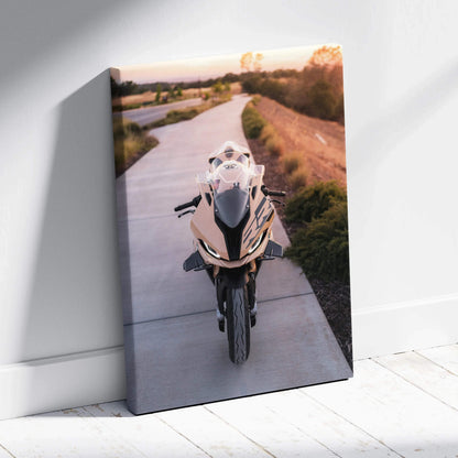 BMW S1000RR motorcycle canvas wall art with sleek bike on scenic pathway in vibrant sunset tones.