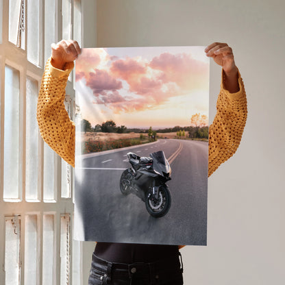 Yamaha R6 motorcycle on open road at sunset poster wall art with pink sky and clouds.