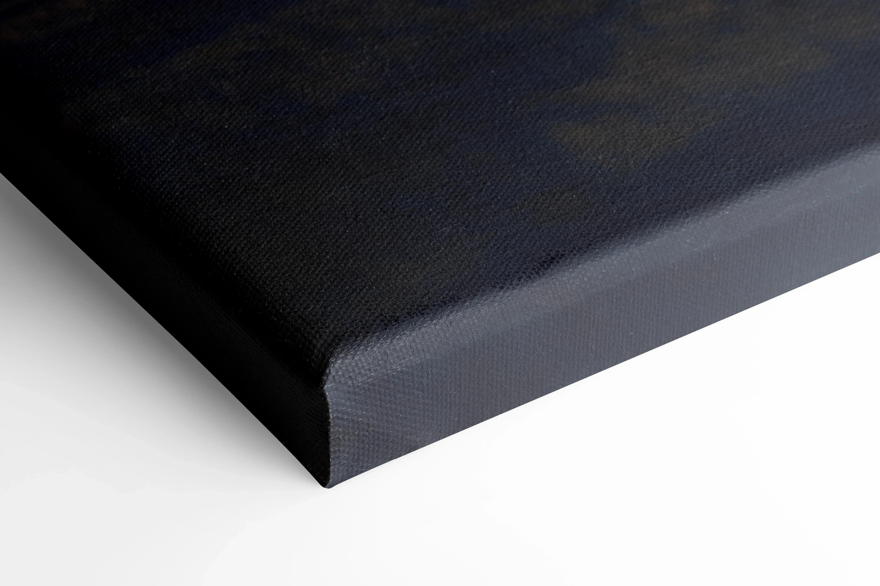 Black canvas art print corner with museum-quality stretched canvas and clean edges for wall art display.