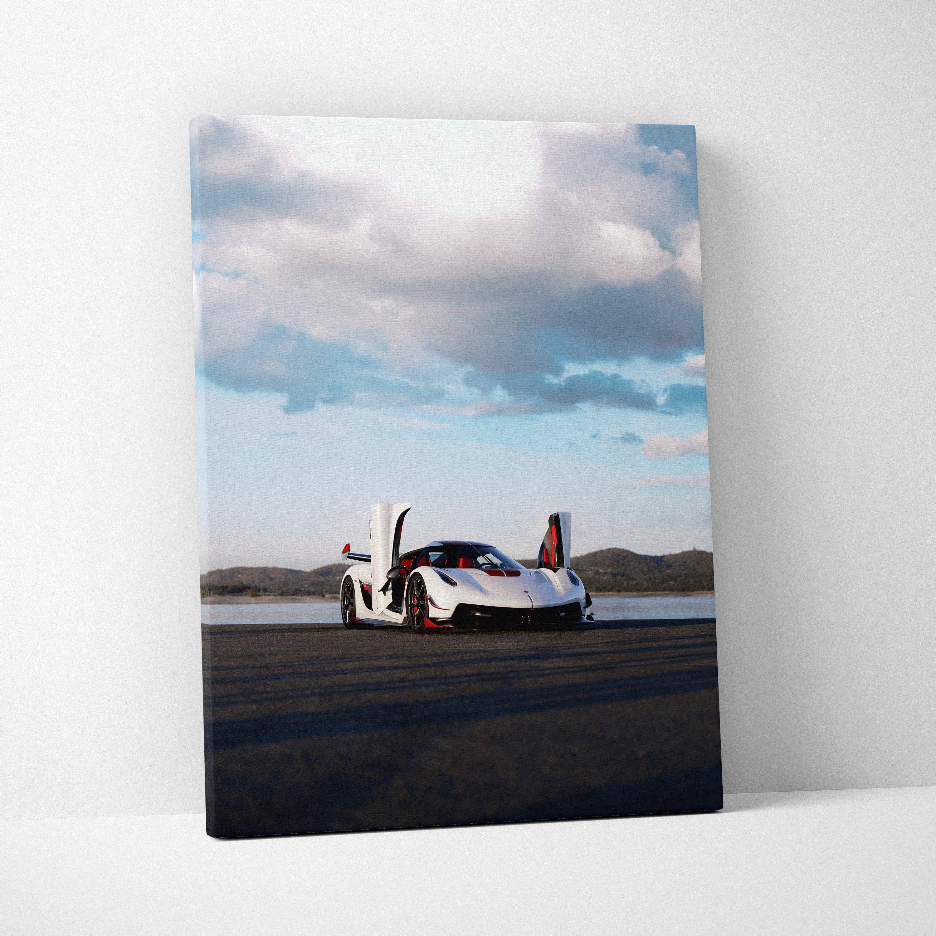 Koenigsegg Jesko sports car on road under cloudy sky vertical canvas wall art.