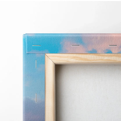 Close-up of wooden frame and blue canvas backing with pink accents for vertical wall art canvas print.