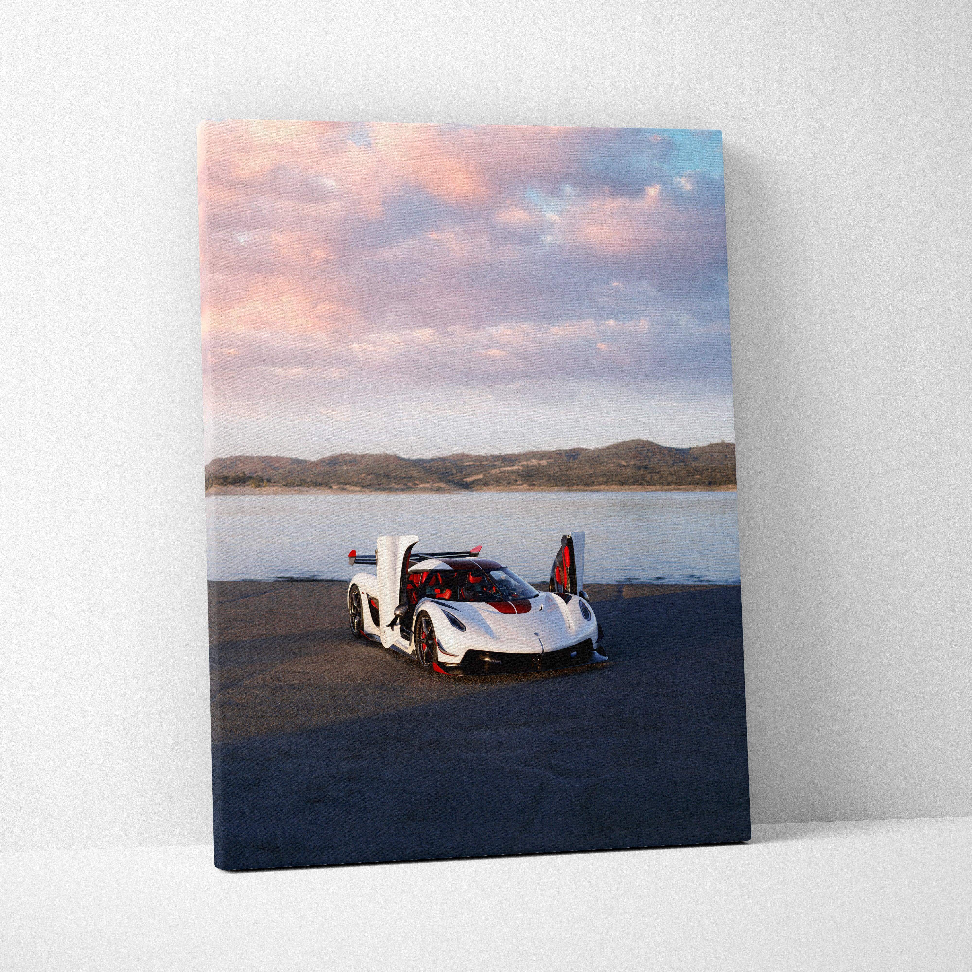 Canvas wall art featuring a white and red koenigsegg jesko hypercar with butterfly doors against a sunset sky