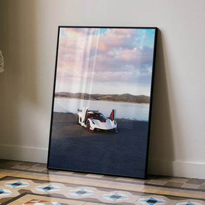 Koenigsegg Jesko poster wall art featuring white sports car on dark pavement with lake and mountains background.
