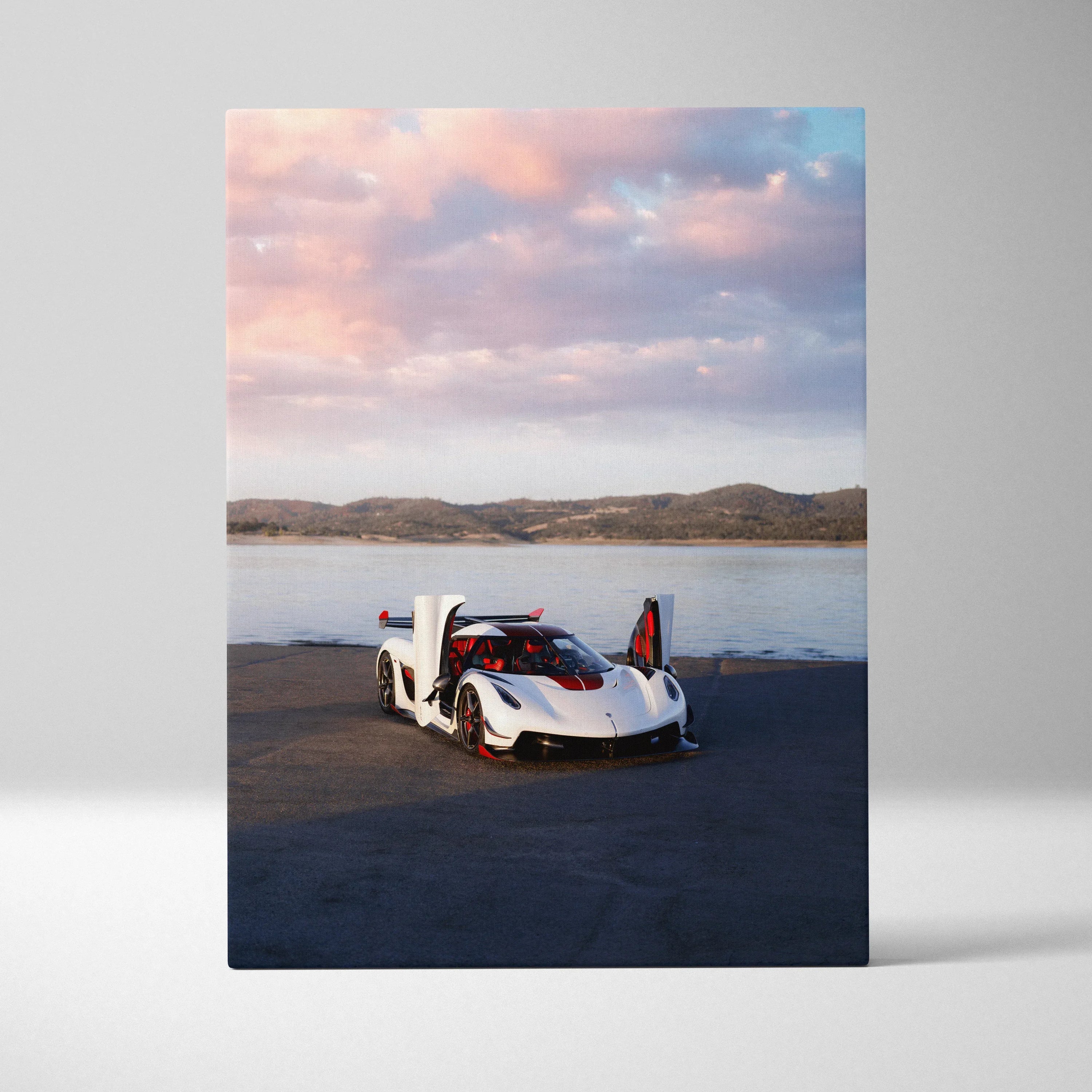 Koenigsegg Jesko luxury sports car with butterfly doors open by lake at sunset canvas wall art.