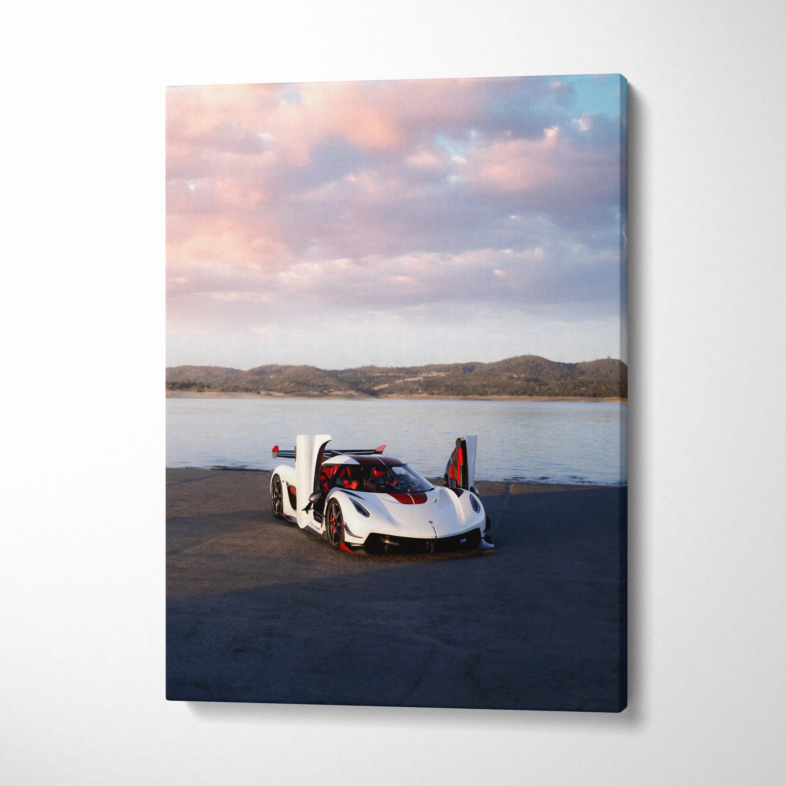 Koenigsegg Jesko white hypercar with open doors on asphalt by water canvas wall art.