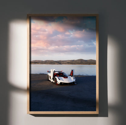 Koenigsegg Jesko car poster showing white sports car by water with mountainous background wall art.