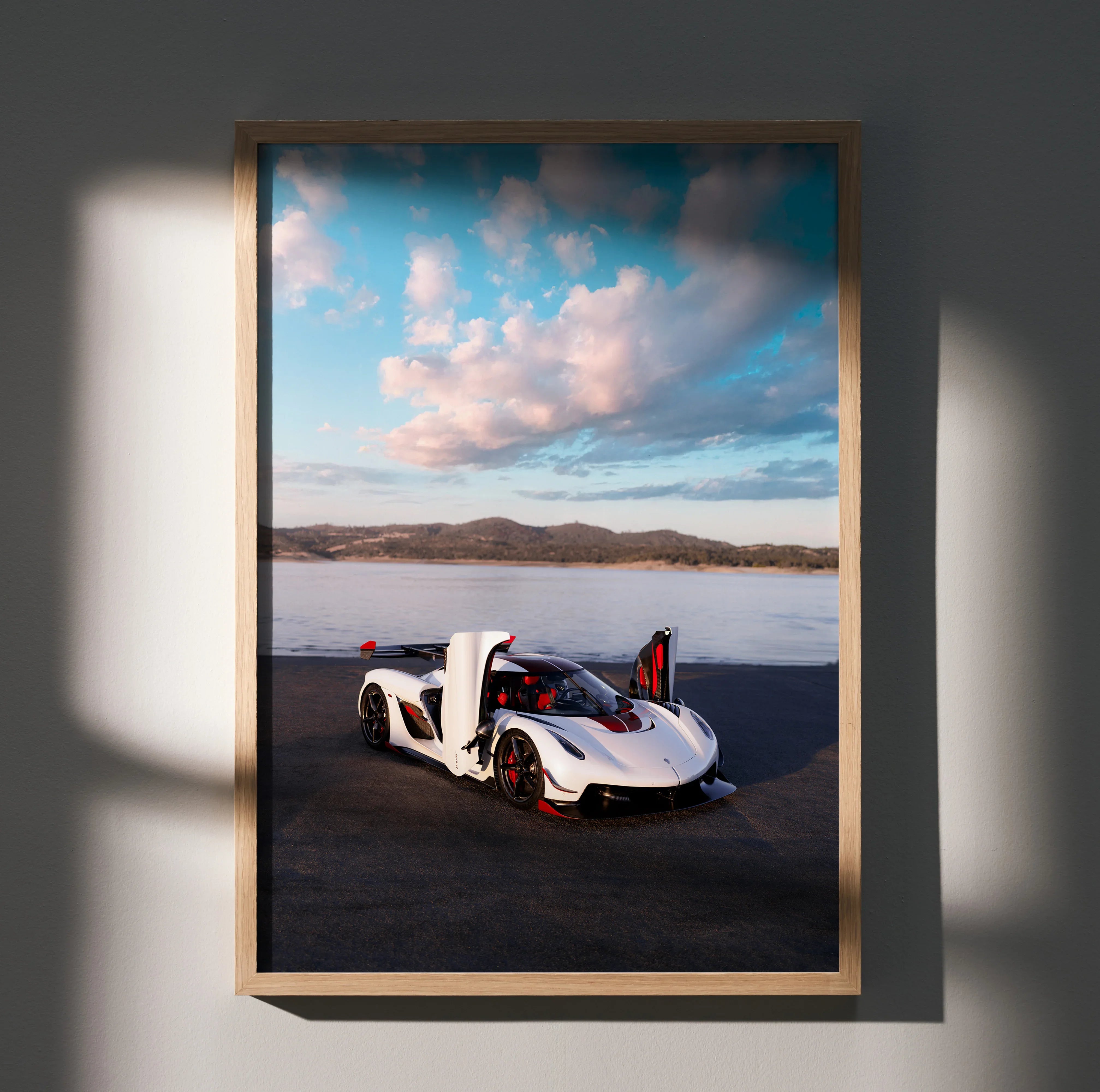Koenigsegg Jesko poster wall art featuring white sports car with scissor doors on desert background.