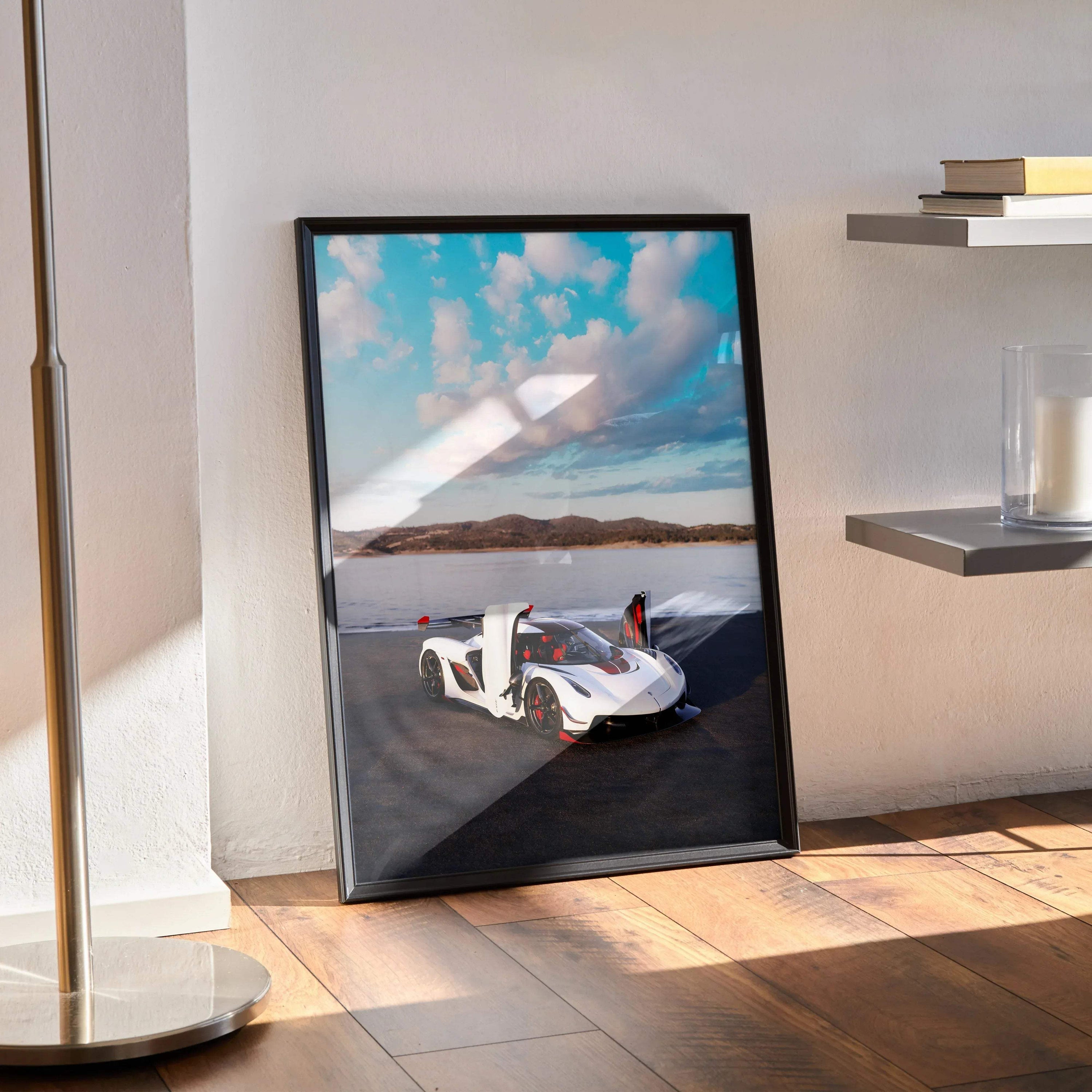 Koenigsegg Jesko poster wall art featuring a white Jesko sports car under a blue sky with clouds.