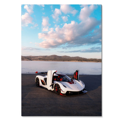 Koenigsegg Jesko sports car with open butterfly doors on asphalt under pink and blue cloudy sky poster wall art.