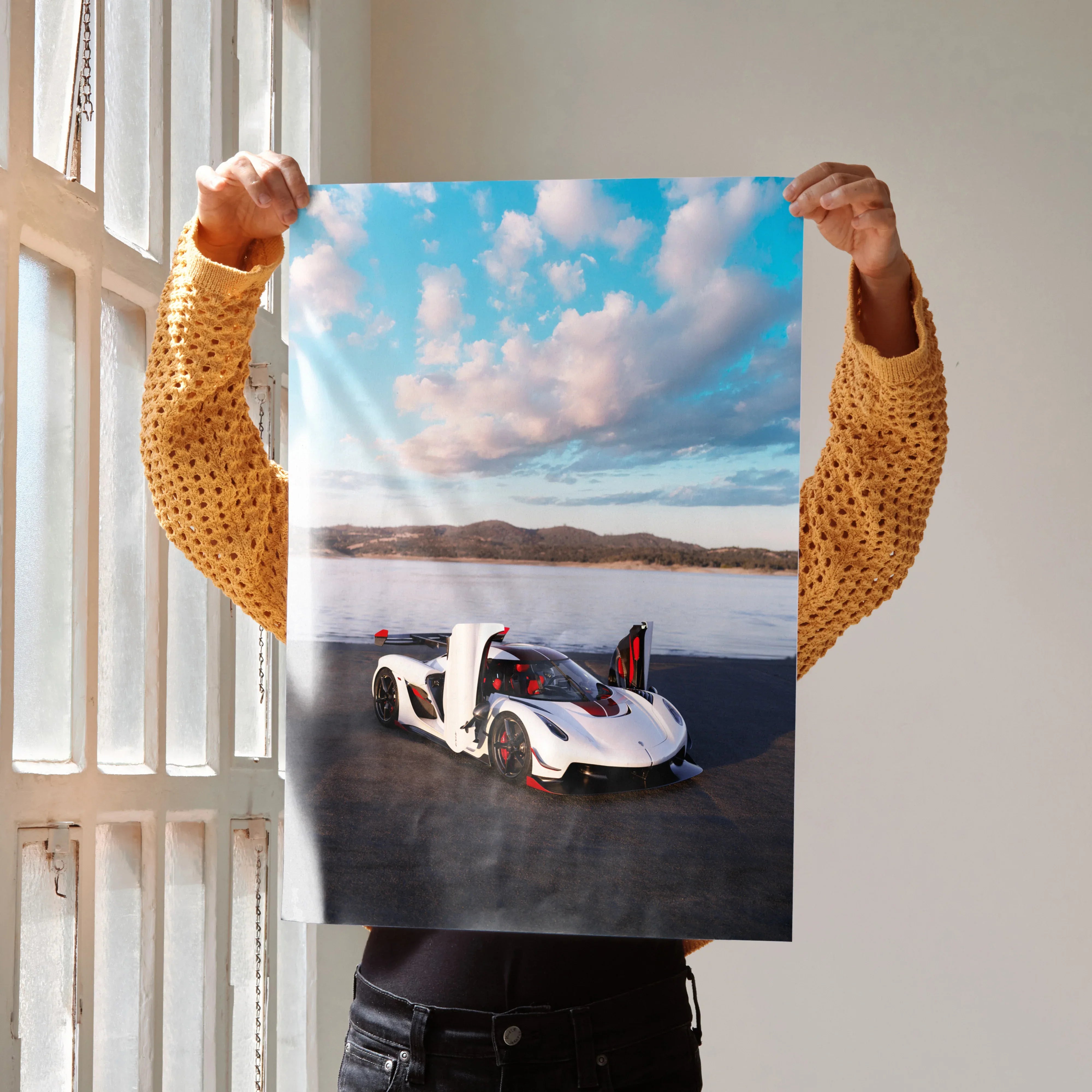 Koenigsegg Jesko poster wall art showing white sports car on open road under blue sky with clouds.