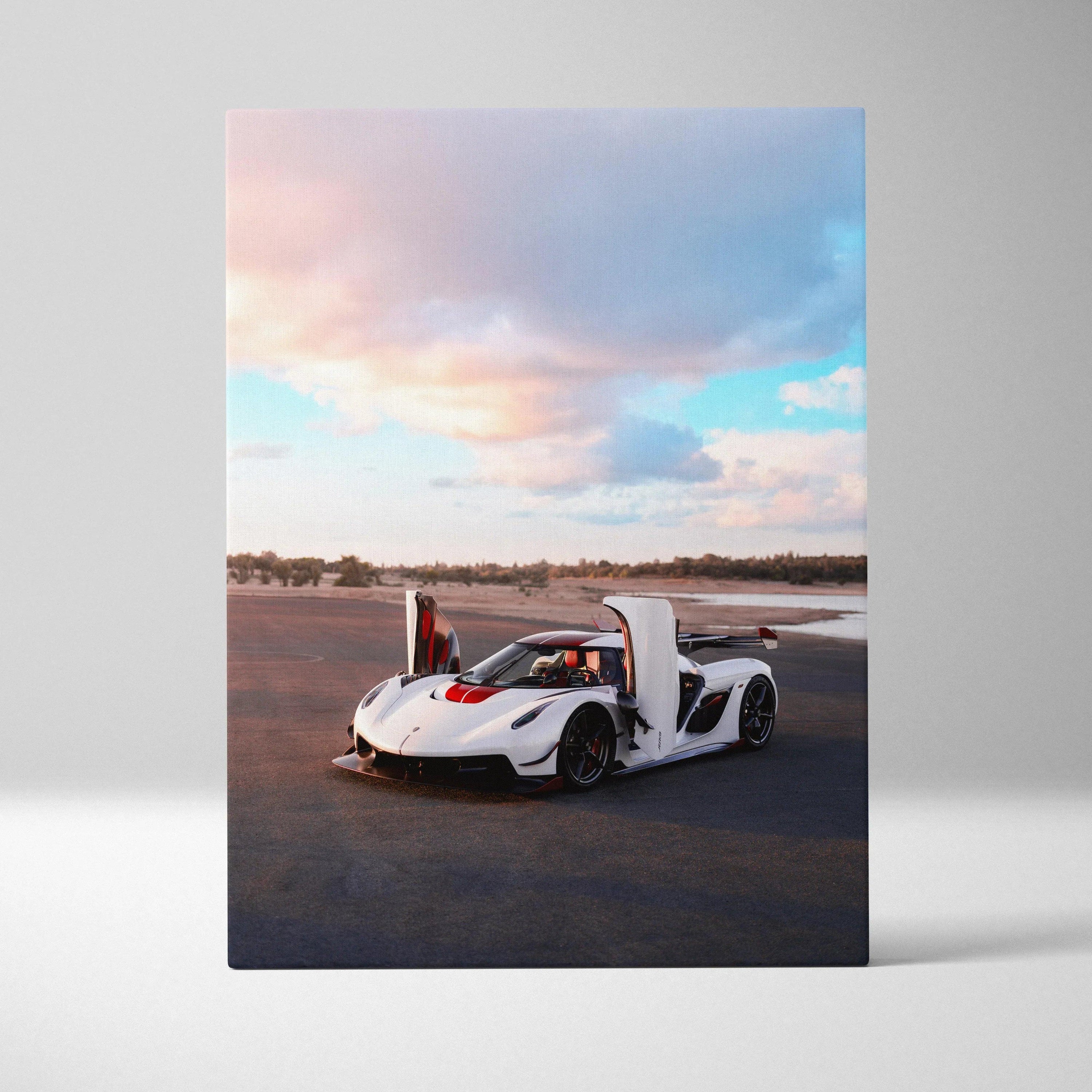 White Koenigsegg Jesko sports car with open doors on canvas wall art under soft sunset sky.
