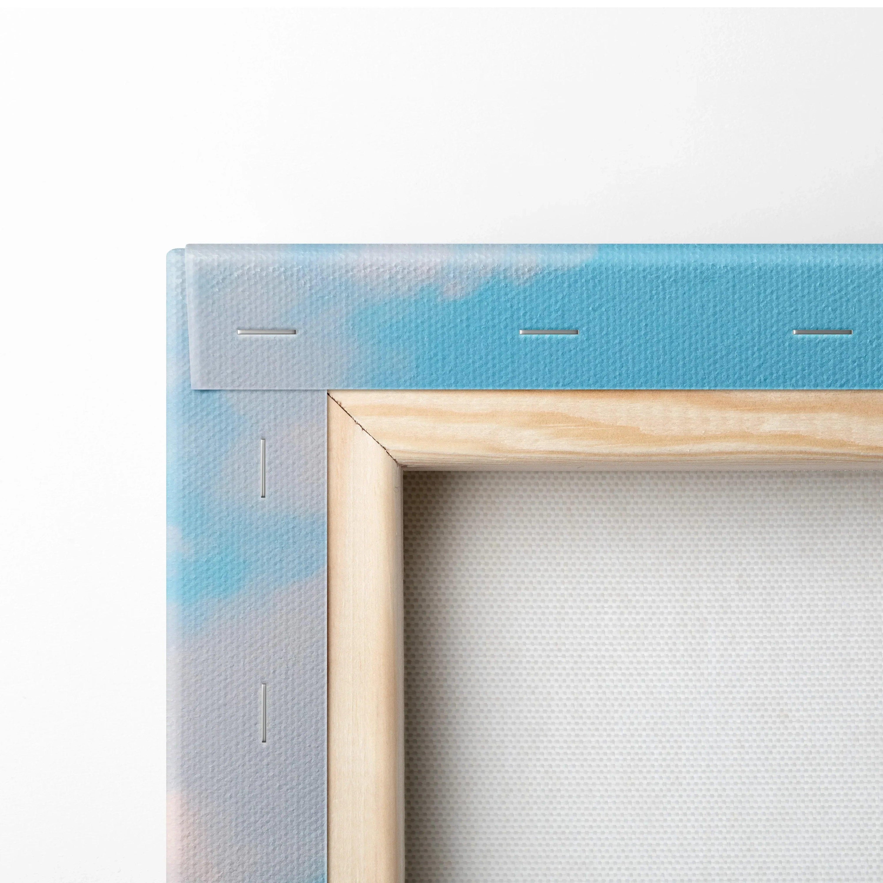 Close-up of natural wood frame and stapled light blue and pink canvas art corner for wall art display.
