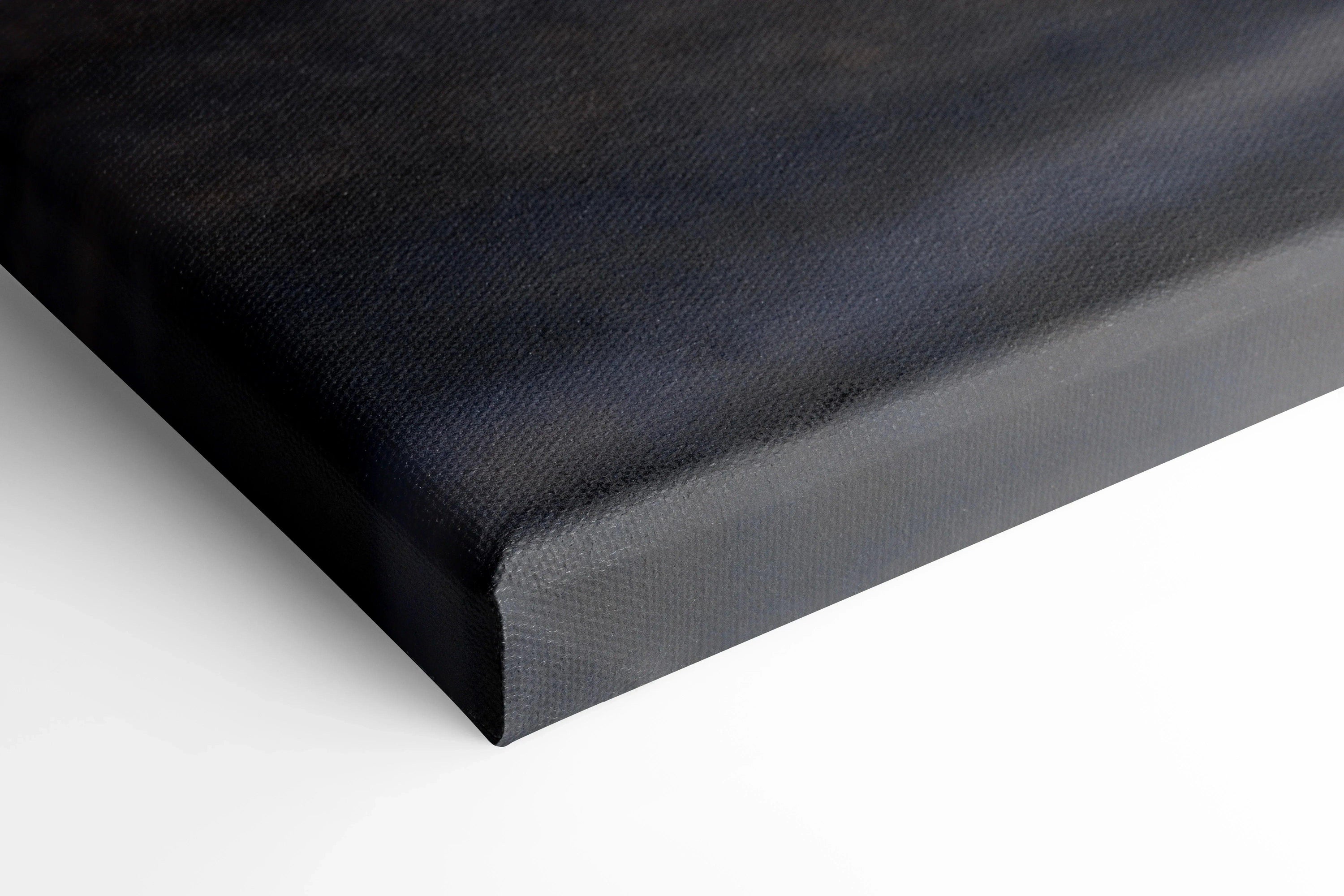 Close-up of black Koenigsegg Jesko car canvas art with textured vertical wall art surface.