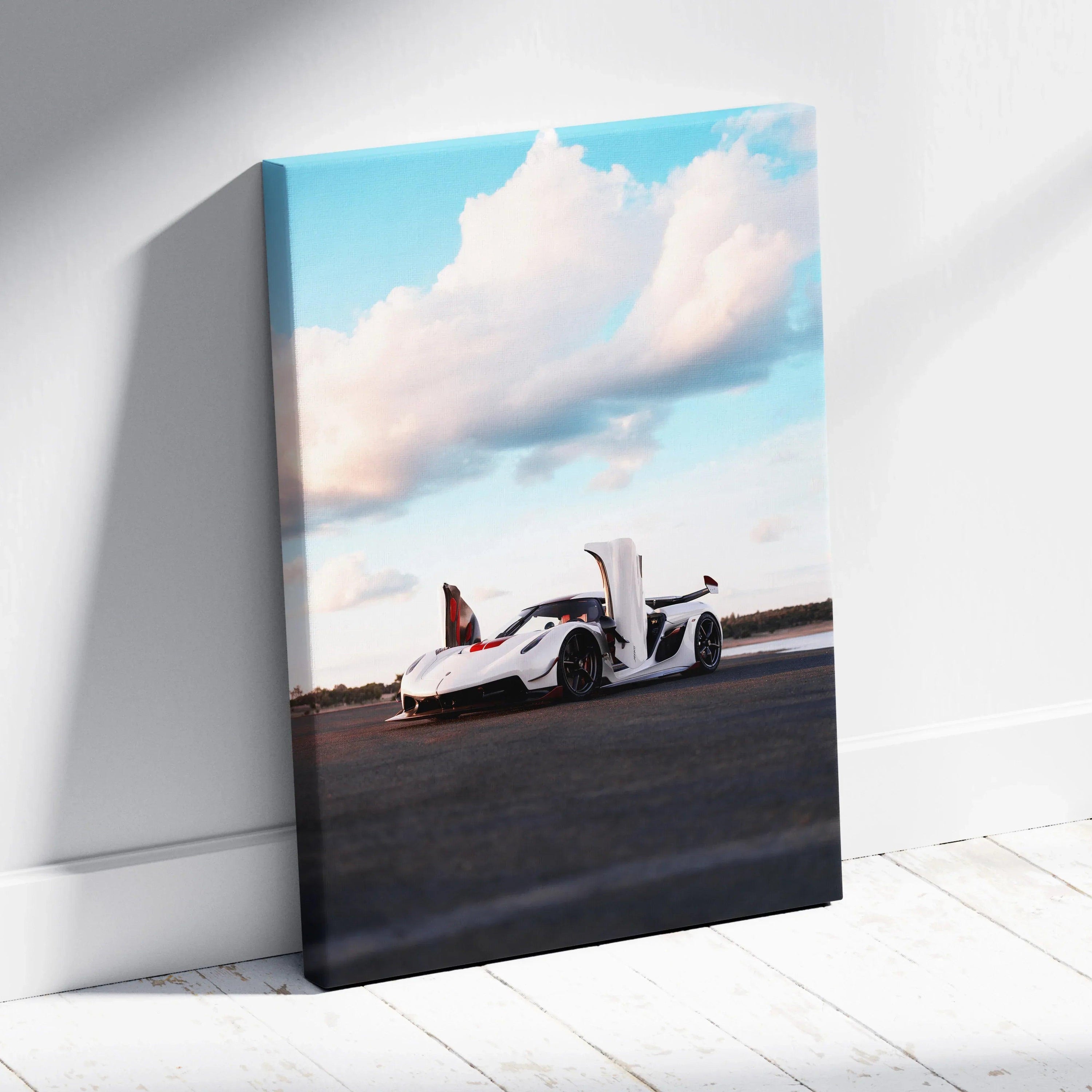 Koenigsegg Jesko sports car with scissor doors open on canvas wall art in vertical format with blue sky background.