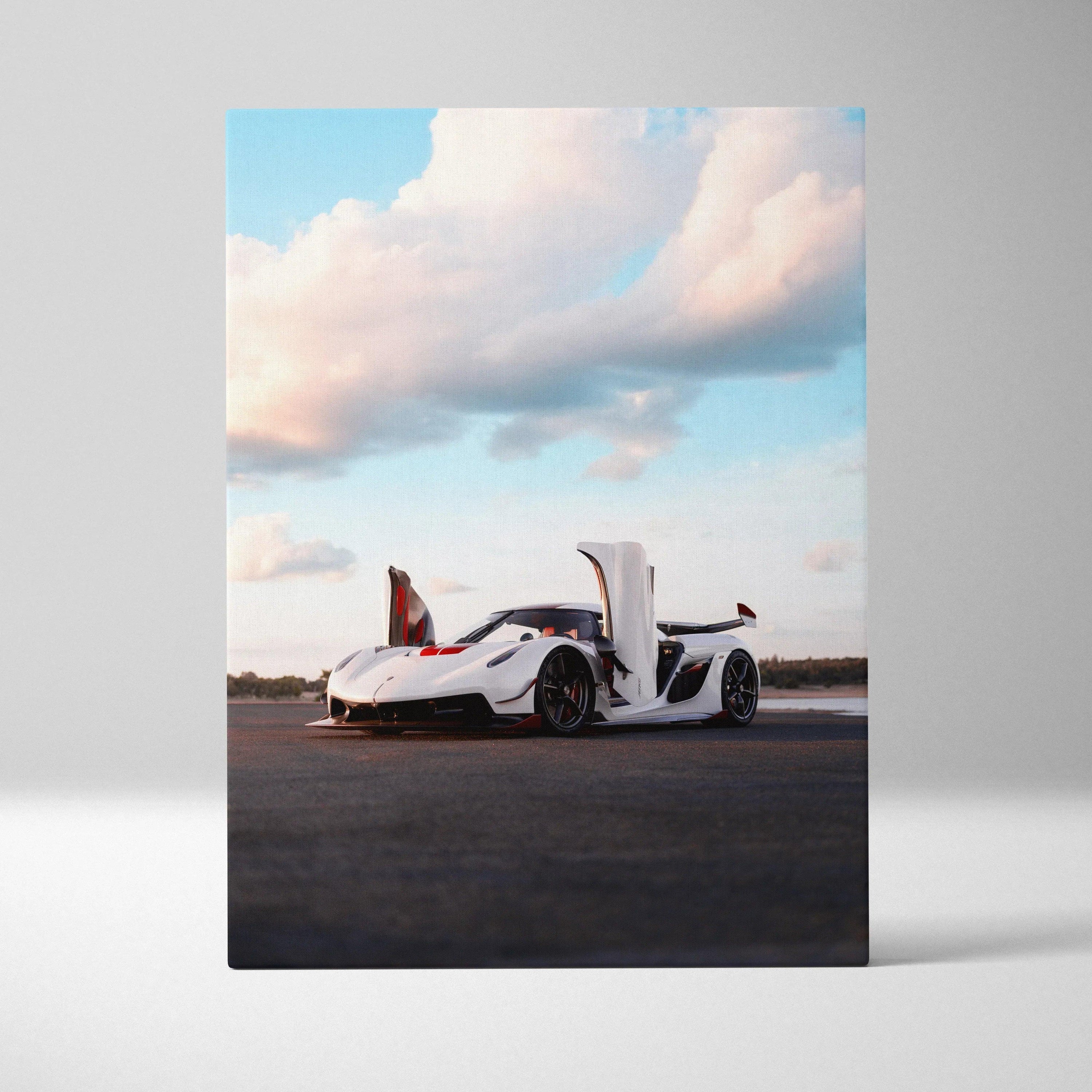 Vertical canvas wall art of white Koenigsegg Jesko supercar with open doors against blue sky clouds.