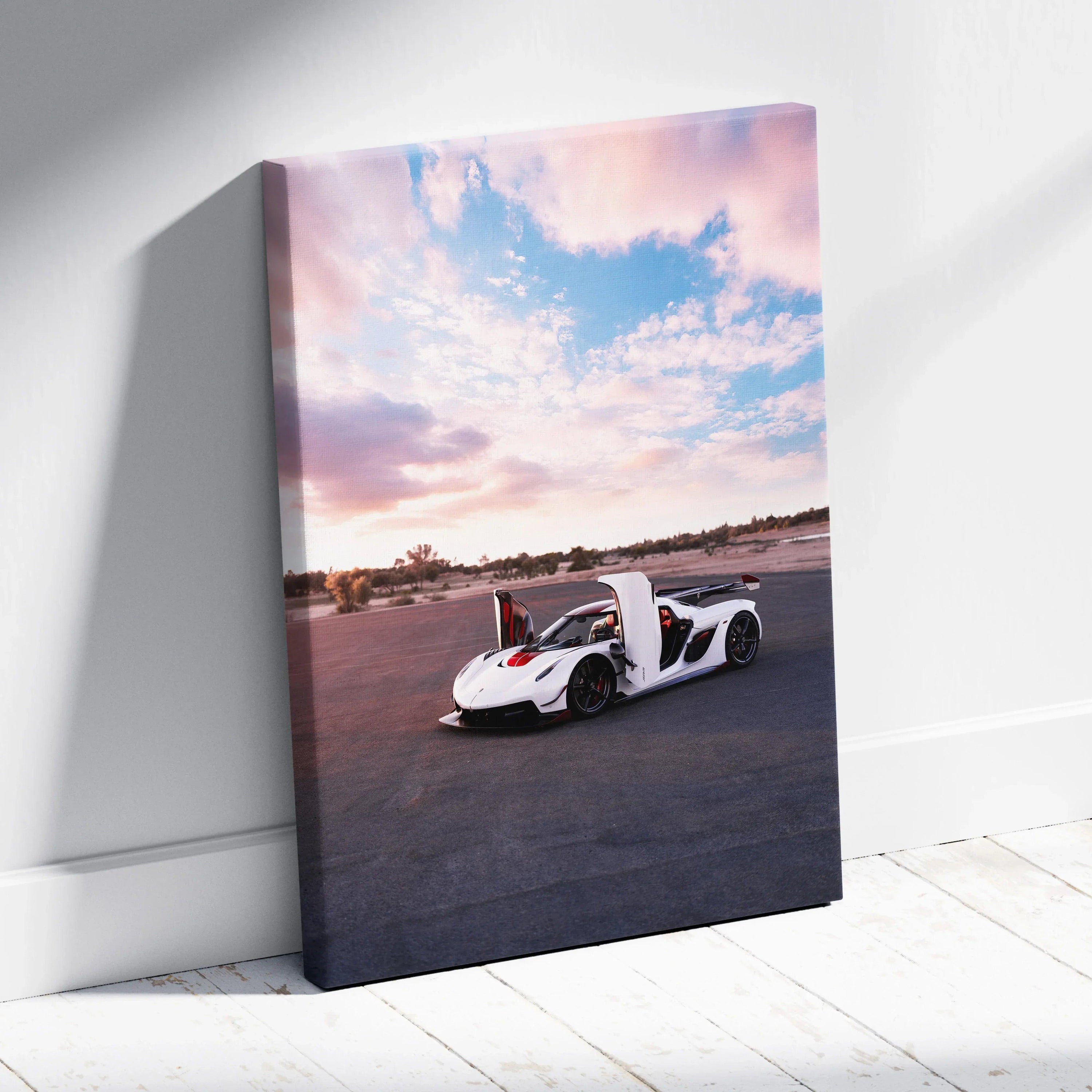 Koenigsegg Jesko white sports car on black asphalt under pink and blue sky vertical canvas wall art.