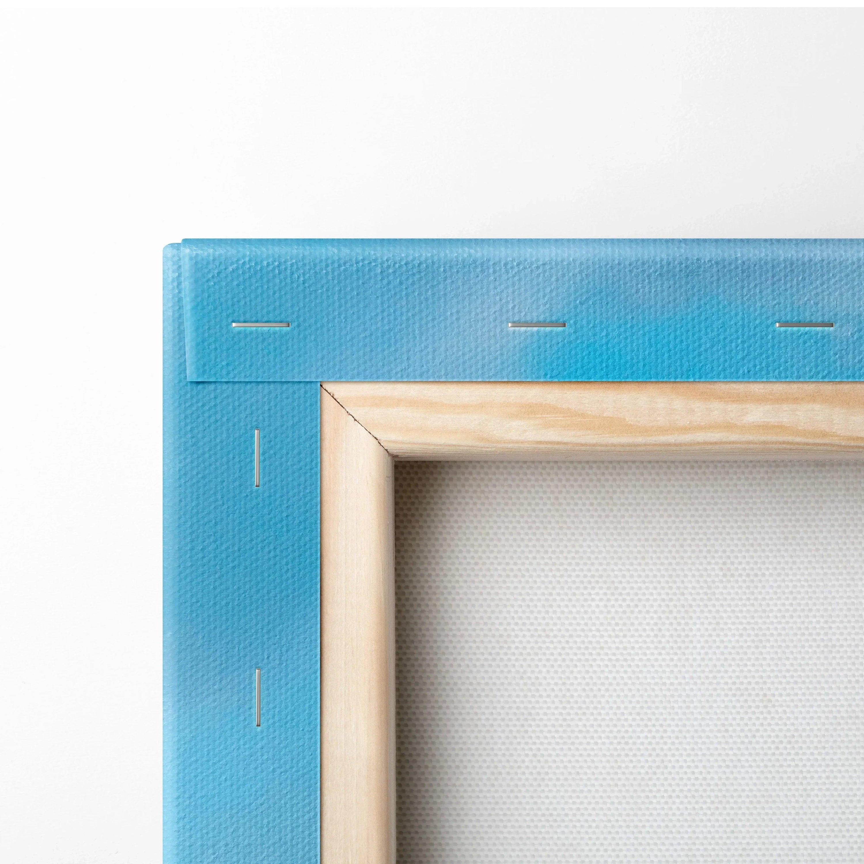 Close-up of wooden frame corner and blue canvas backing for vertical wall art canvas print.