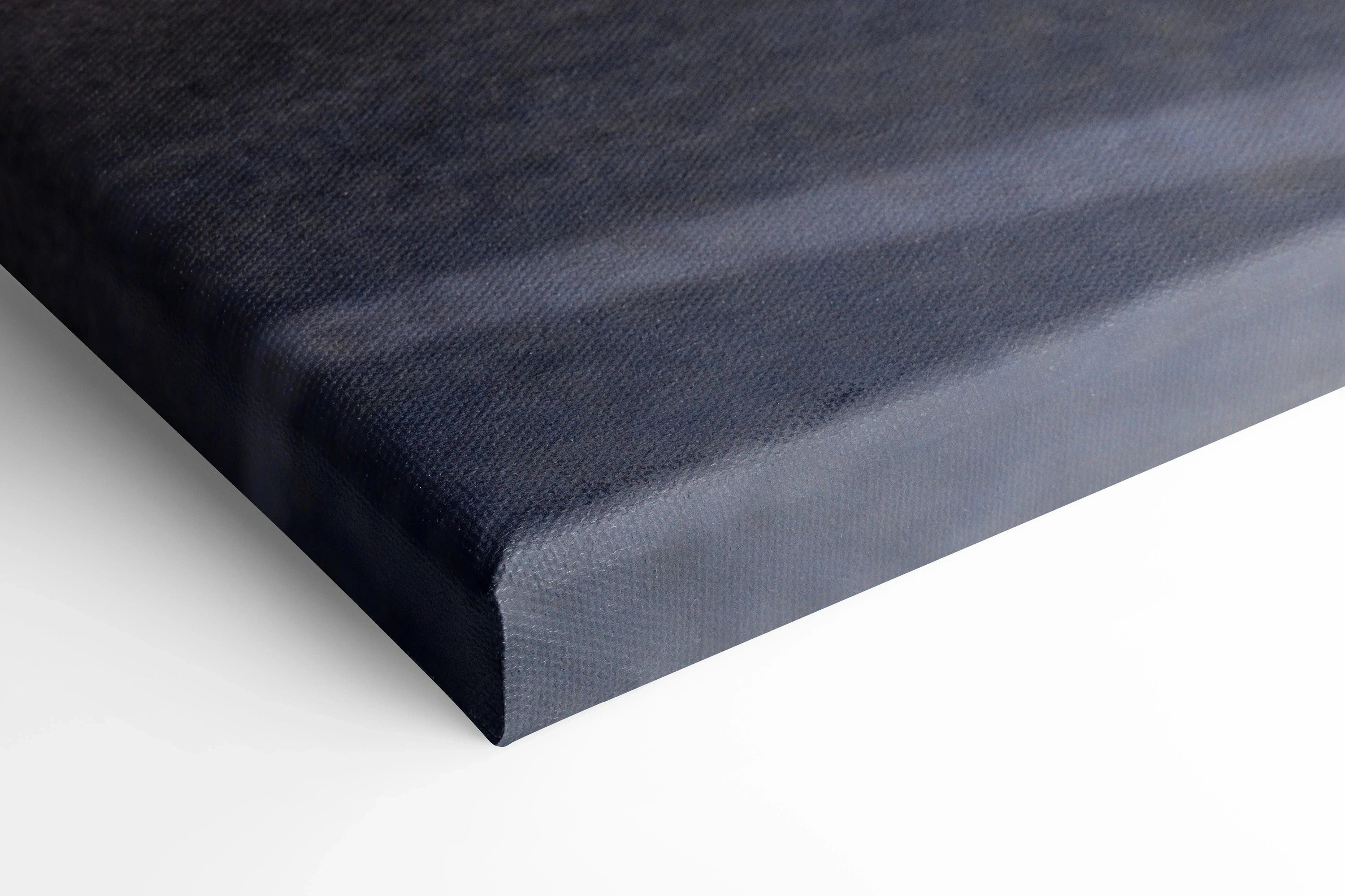 Close-up of black and gray canvas wall art corner with textured finish.