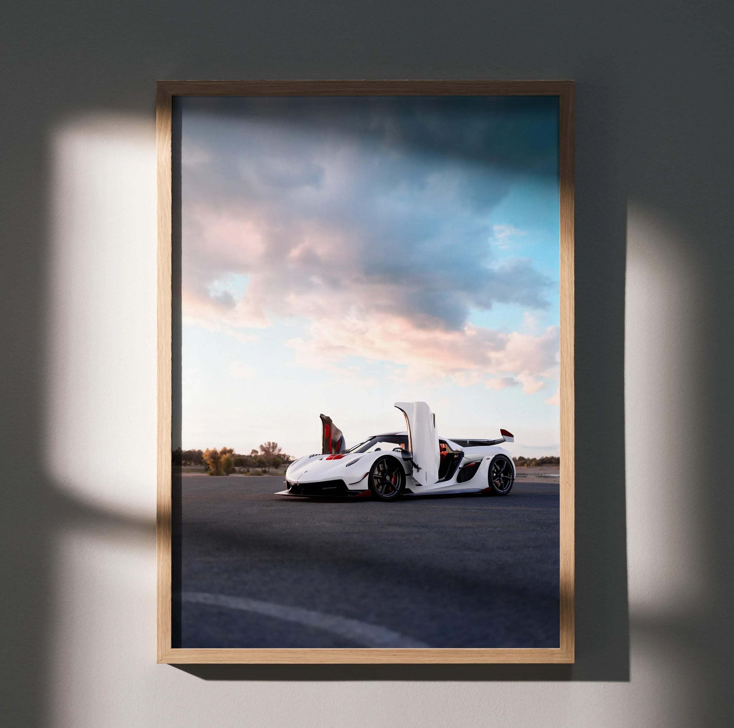Koenigsegg Jesko white sports car parked on road under dramatic sky poster wall art in wooden frame.