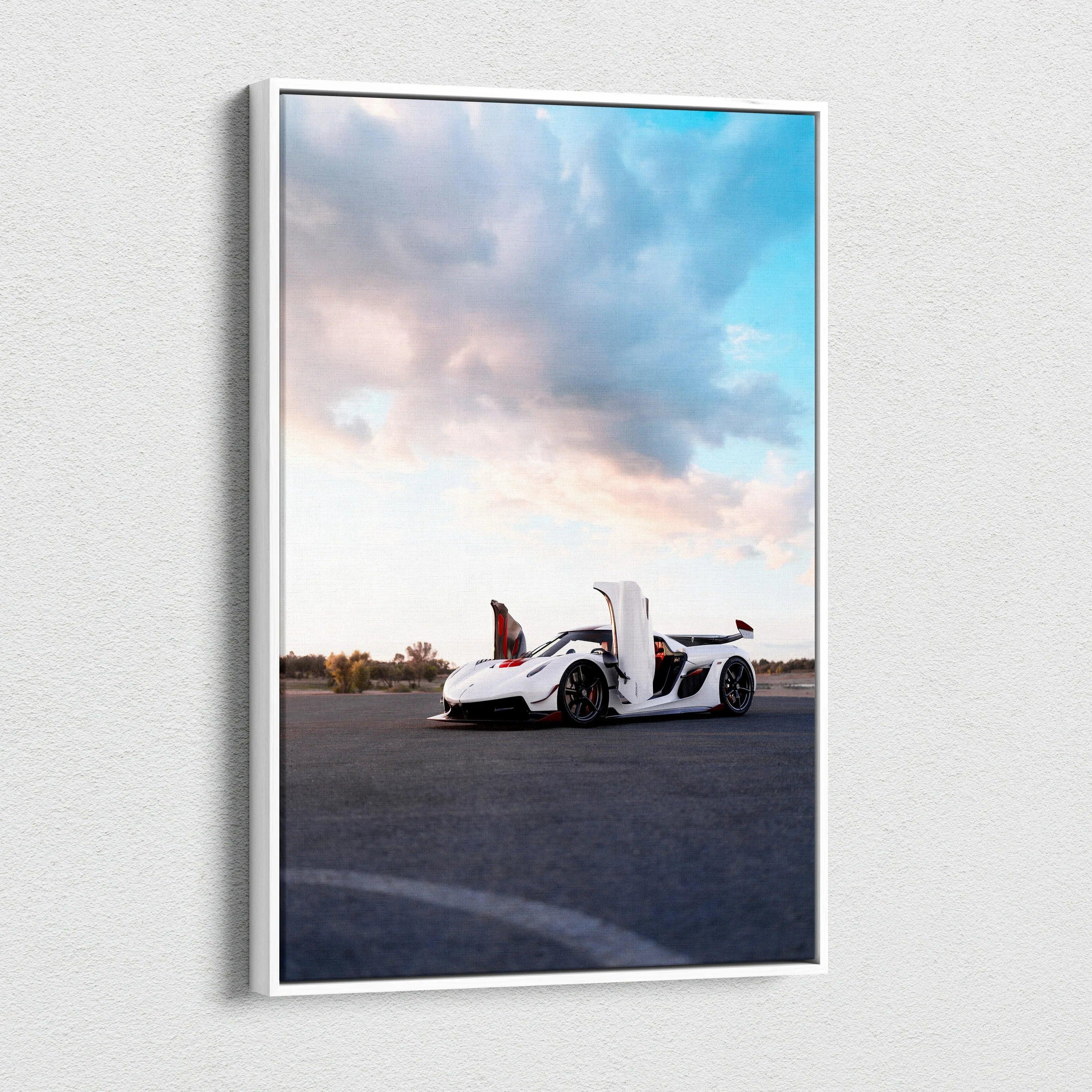 Koenigsegg Jesko white car with doors open on canvas wall art against blue sky and clouds.