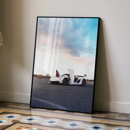 Koenigsegg Jesko white sports car poster with open doors at sunset, wall art in black frame.