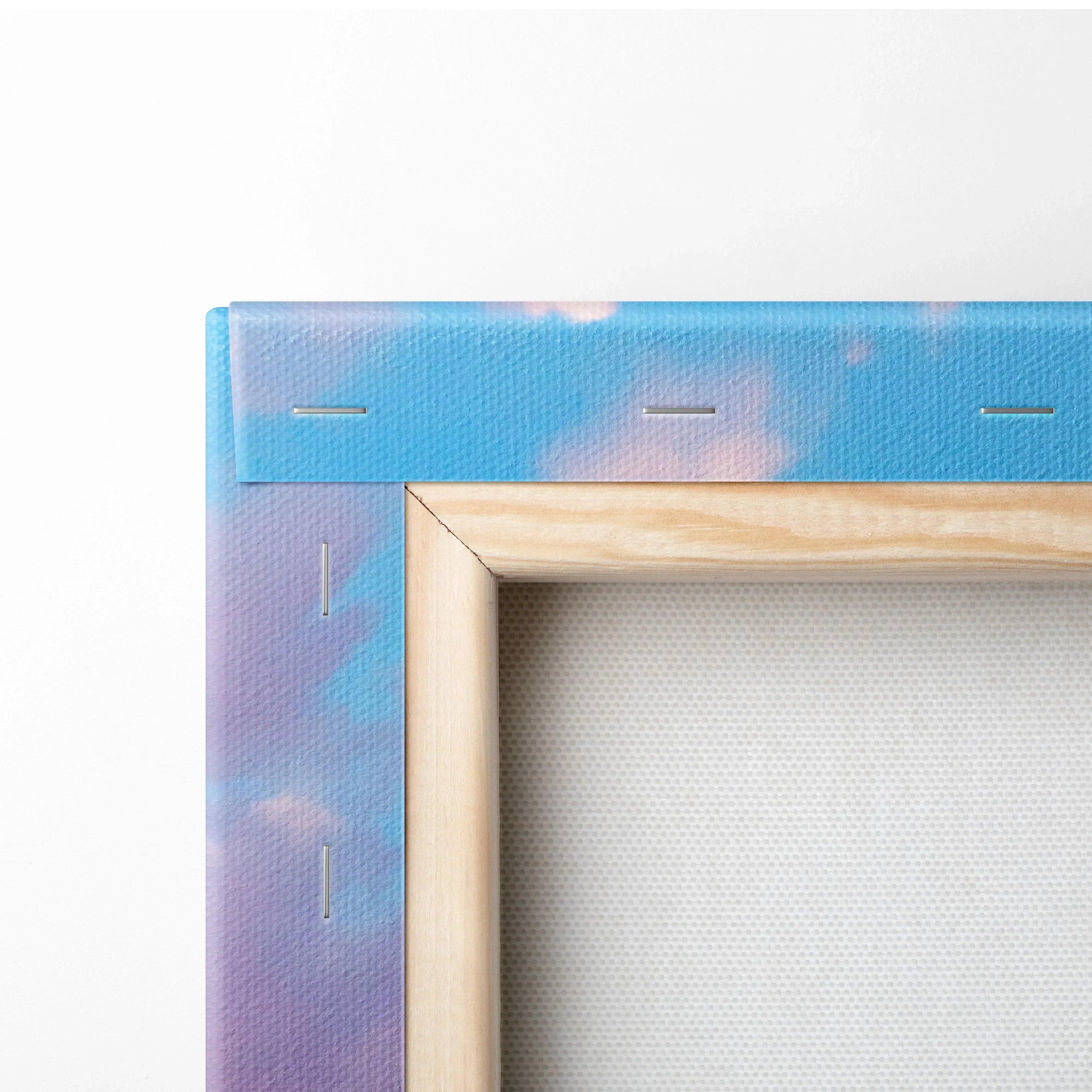 Close-up of wooden frame and stapled blue and purple gradient canvas art for wall decor.